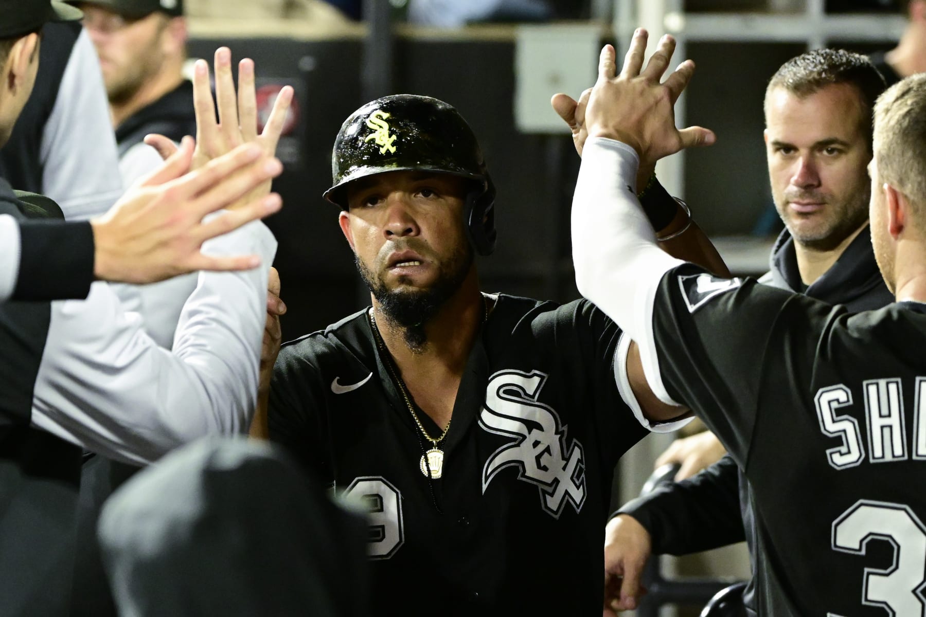 CHICAGO, ILLINOIS - SEPTEMBER 22: Jose Abreu #79 of the Chicago White Sox celebrates in the dugout with teammates after scoring in the first inning against the Cleveland Guardians at Guaranteed Rate Field on September 22, 2022 in Chicago, Illinois. (Photo by Quinn Harris/Getty Images)