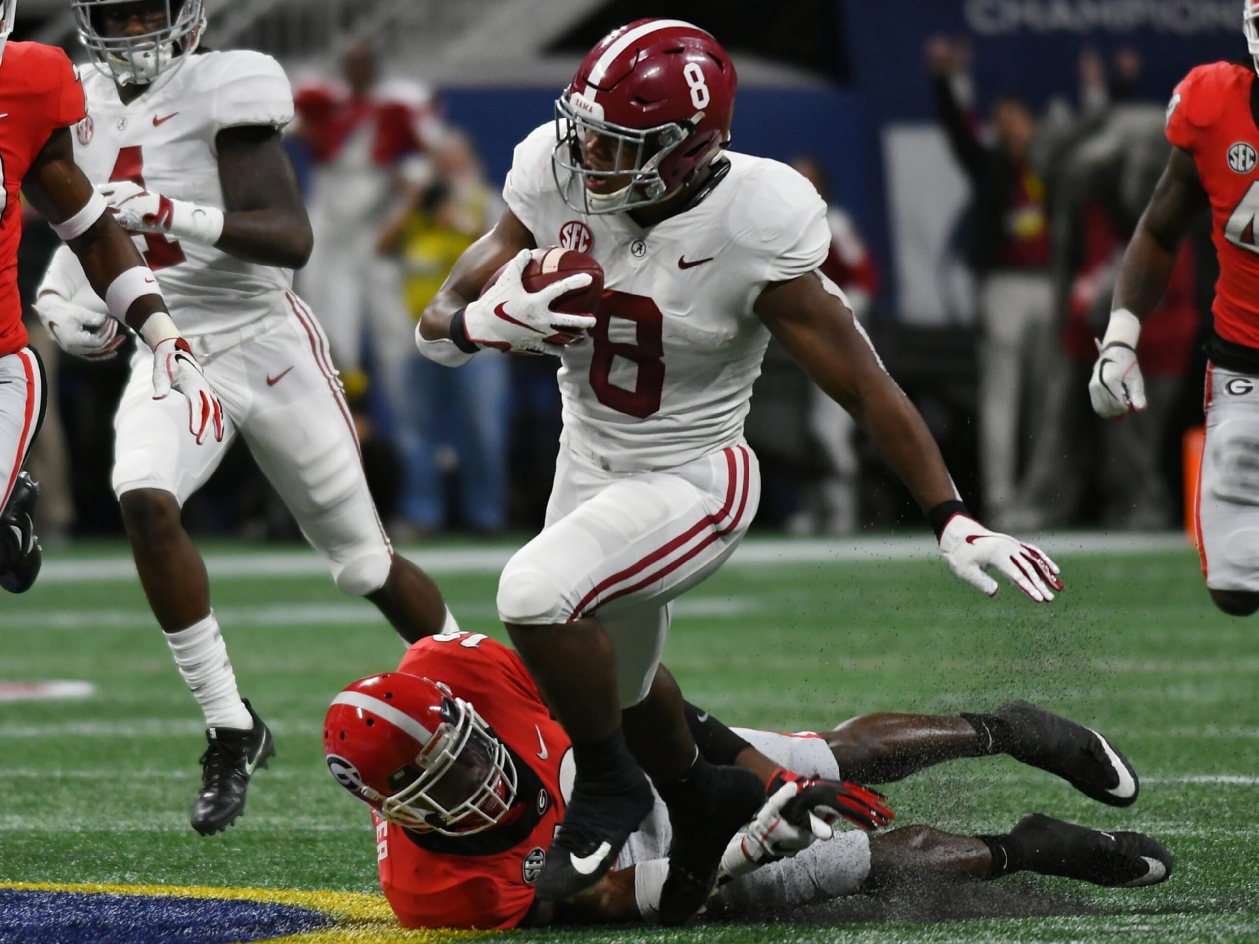 ATLANTA, GA - DECEMBER 01: Alabama Crimson Tide Running Back Josh Jacobs (8) eludes Georgia Bulldogs Defensive Back Deandre Baker (18) during the SEC Championship between the Alabama Crimson Tide and the Georgia Bulldogs on December 01, 2018, at Mercedes-Benz Stadium in Atlanta, GA. (Photo by Jeffrey Vest/Icon Sportswire via Getty Images)