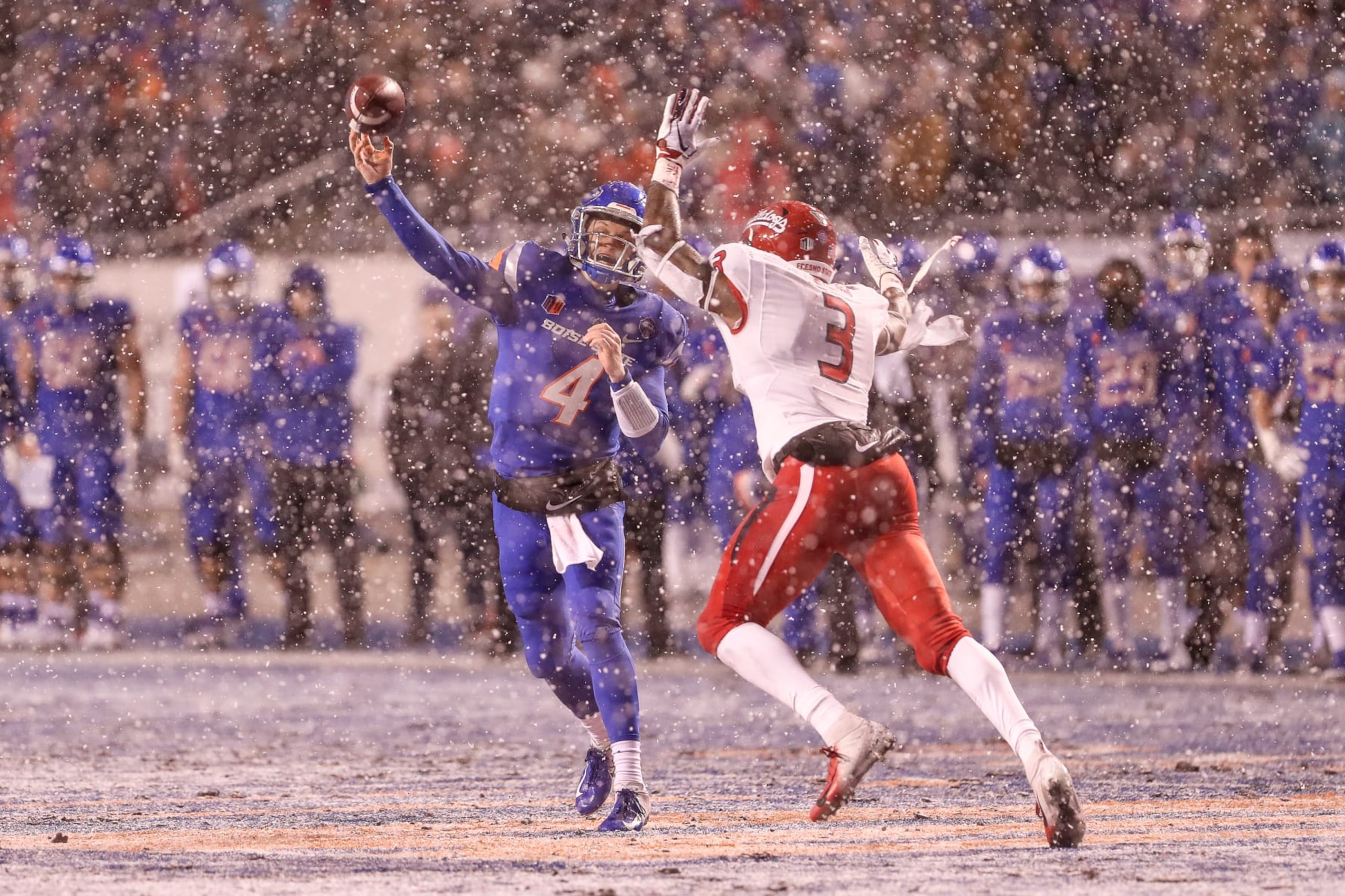 BOISE, ID - DECEMBER 1: Quarterback Brett Rypien #4 of the Boise State Broncos throws a pass through the defensive end Mykal Walker #3 of the Fresno State Bulldogs during first half action in the Mountain West Championship on December 1, 2018 at Albertsons Stadium in Boise, Idaho. Fresno State won the game 19-16 in overtime. (Photo by Loren Orr/Getty Images)