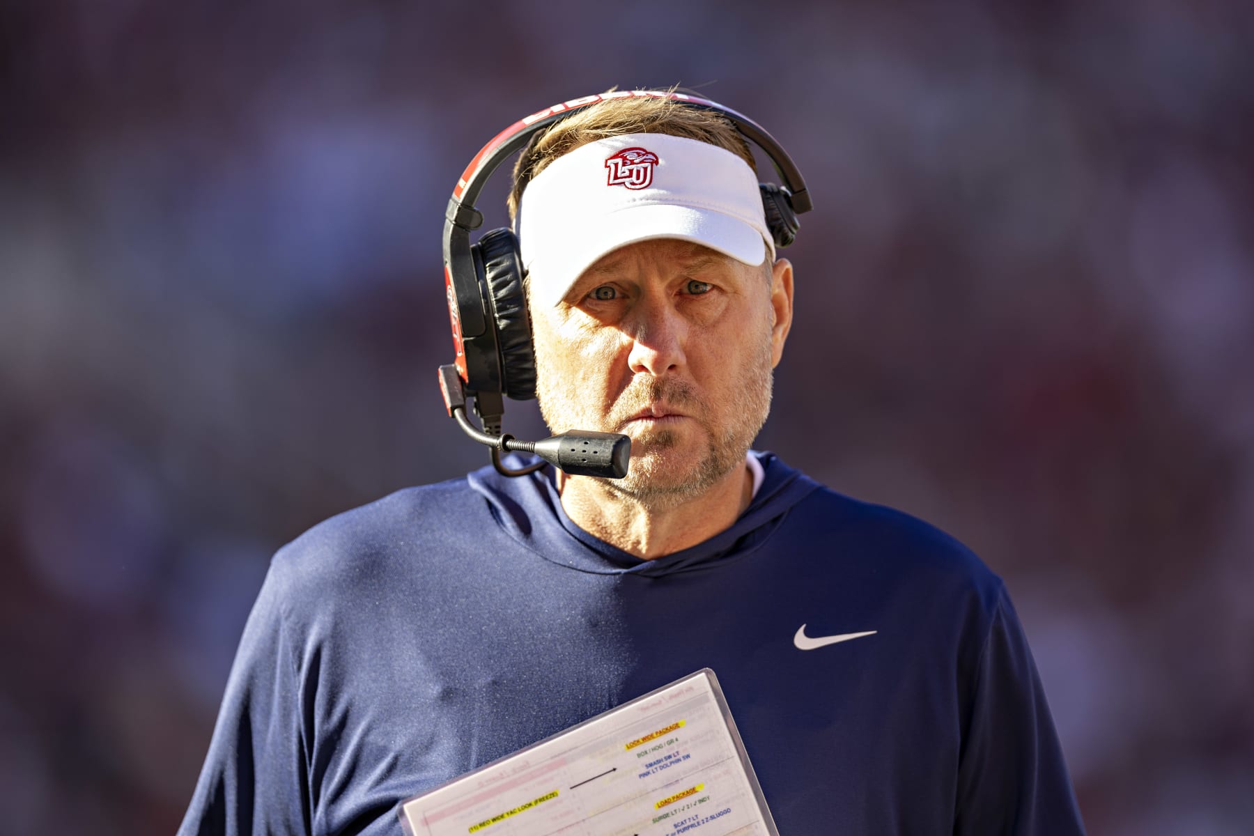FAYETTEVILLE, ARKANSAS - NOVEMBER 05:  Head Coach Hugh Freeze of the Liberty Flames on the sidelines during a game against the Arkansas Razorbacks at Donald W. Reynolds Razorback Stadium on November 5, 2022 in Fayetteville, Arkansas. The Flames defeated the Razorbacks 21-19.  (Photo by Wesley Hitt/Getty Images)
