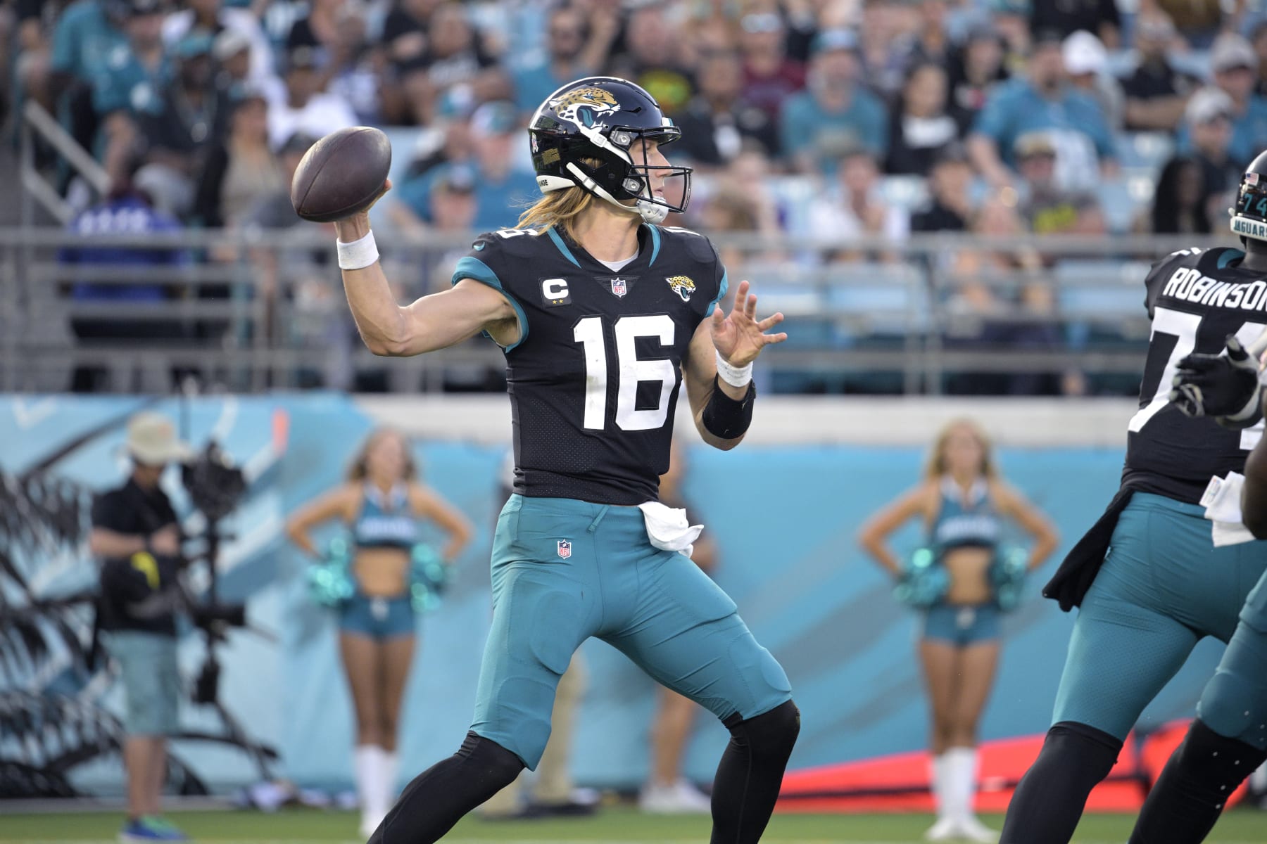 Jacksonville Jaguars quarterback Trevor Lawrence (16) throws a pass during the second half of an NFL football game against the Baltimore Ravens, Sunday, Nov. 27, 2022, in Jacksonville, Fla. (AP Photo/Phelan M. Ebenhack)