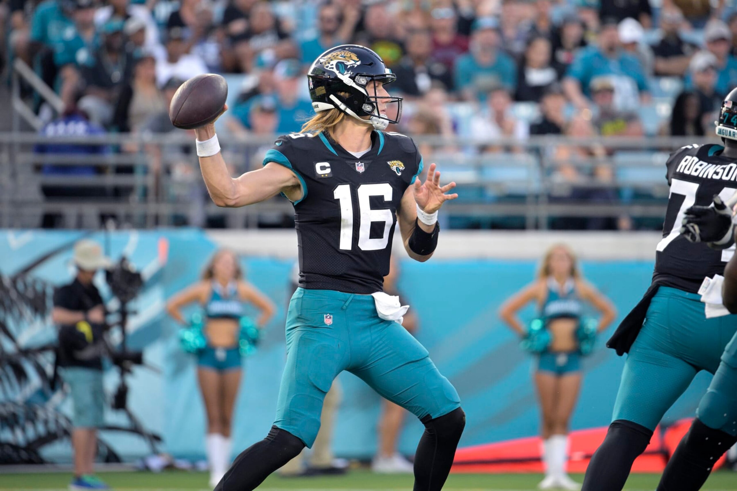 Jacksonville Jaguars quarterback Trevor Lawrence (16) throws a pass during the second half of an NFL football game against the Baltimore Ravens, Sunday, Nov. 27, 2022, in Jacksonville, Fla. (AP Photo/Phelan M. Ebenhack)