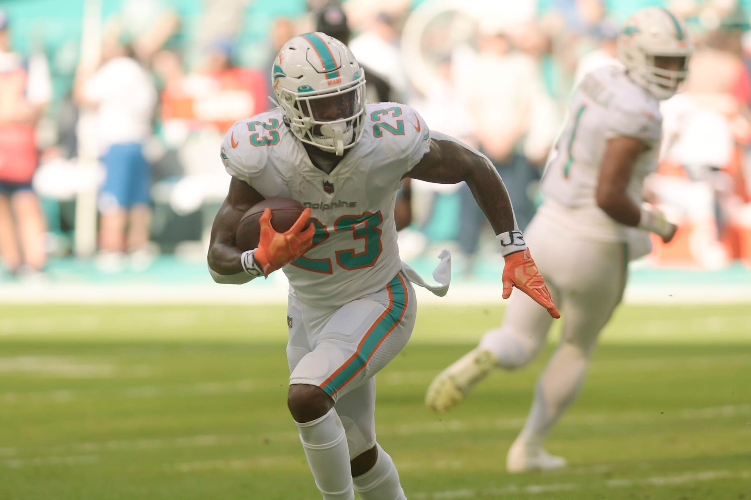 Miami Dolphins running back Jeff Wilson Jr. (23) runs the ball during the first half of an NFL football game against the Houston Texans, Sunday, Nov. 27, 2022, in Miami Gardens, Fla. (AP Photo/Michael Laughlin)