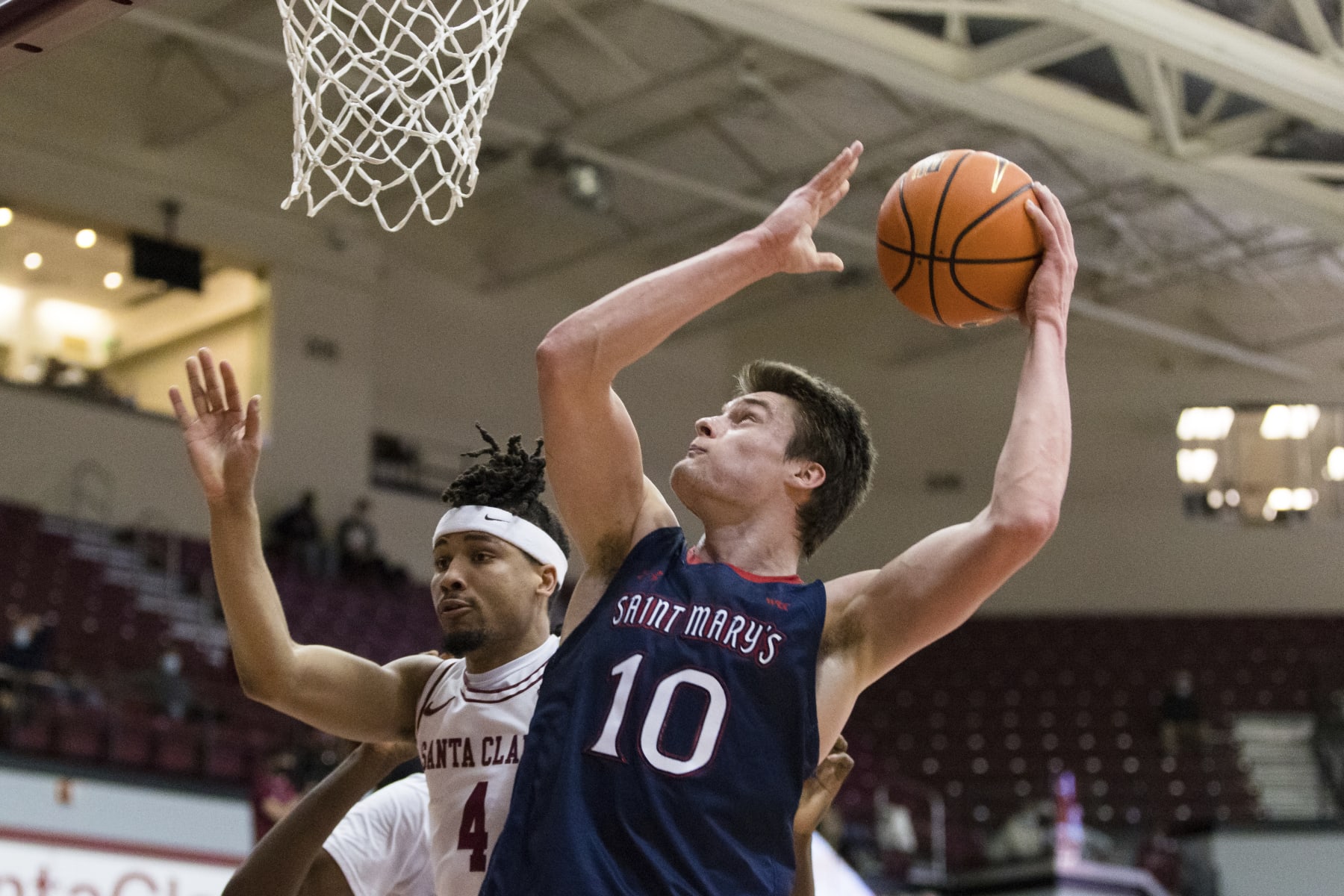 Saint Mary's center Mitchell Saxen (10) shoots over Santa Clara guard Giordan Williams (4) during the first half of an NCAA college basketball game Tuesday, Feb. 8, 2022, in Santa Clara, Calif. (AP Photo/John Hefti)