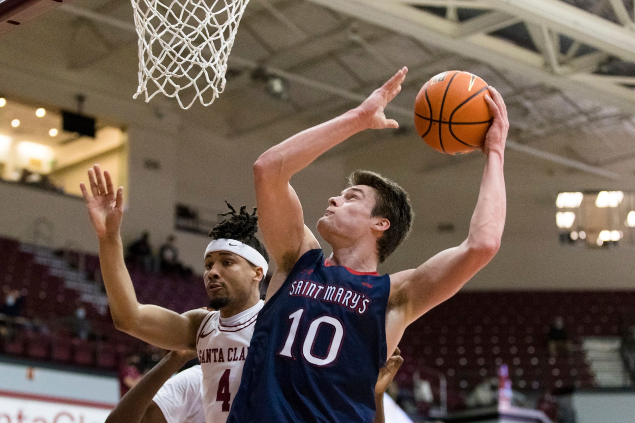 Saint Mary's center Mitchell Saxen (10) shoots over Santa Clara guard Giordan Williams (4) during the first half of an NCAA college basketball game Tuesday, Feb. 8, 2022, in Santa Clara, Calif. (AP Photo/John Hefti)