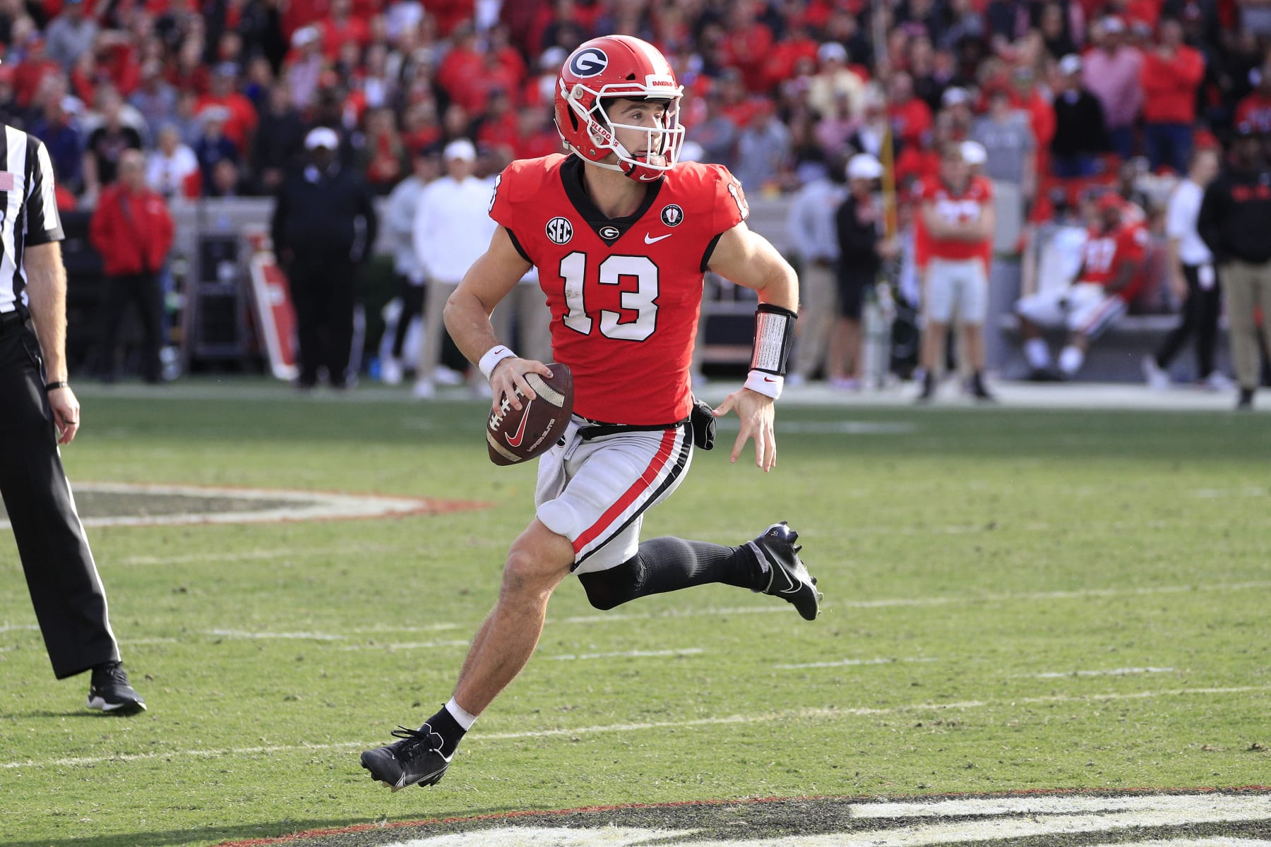 ATHENS, GA - NOVEMBER 26: Georgia Bulldogs starting quarterback Stetson Bennett (13) rolls out during second half of the Saturday afternoon college football game between the University of Georgia Bulldogs and the Georgia Tech Yellow Jackets on November 26, 2022 at Sanford Stadium in Athens, GA.  (Photo by David J. Griffin/Icon Sportswire via Getty Images)