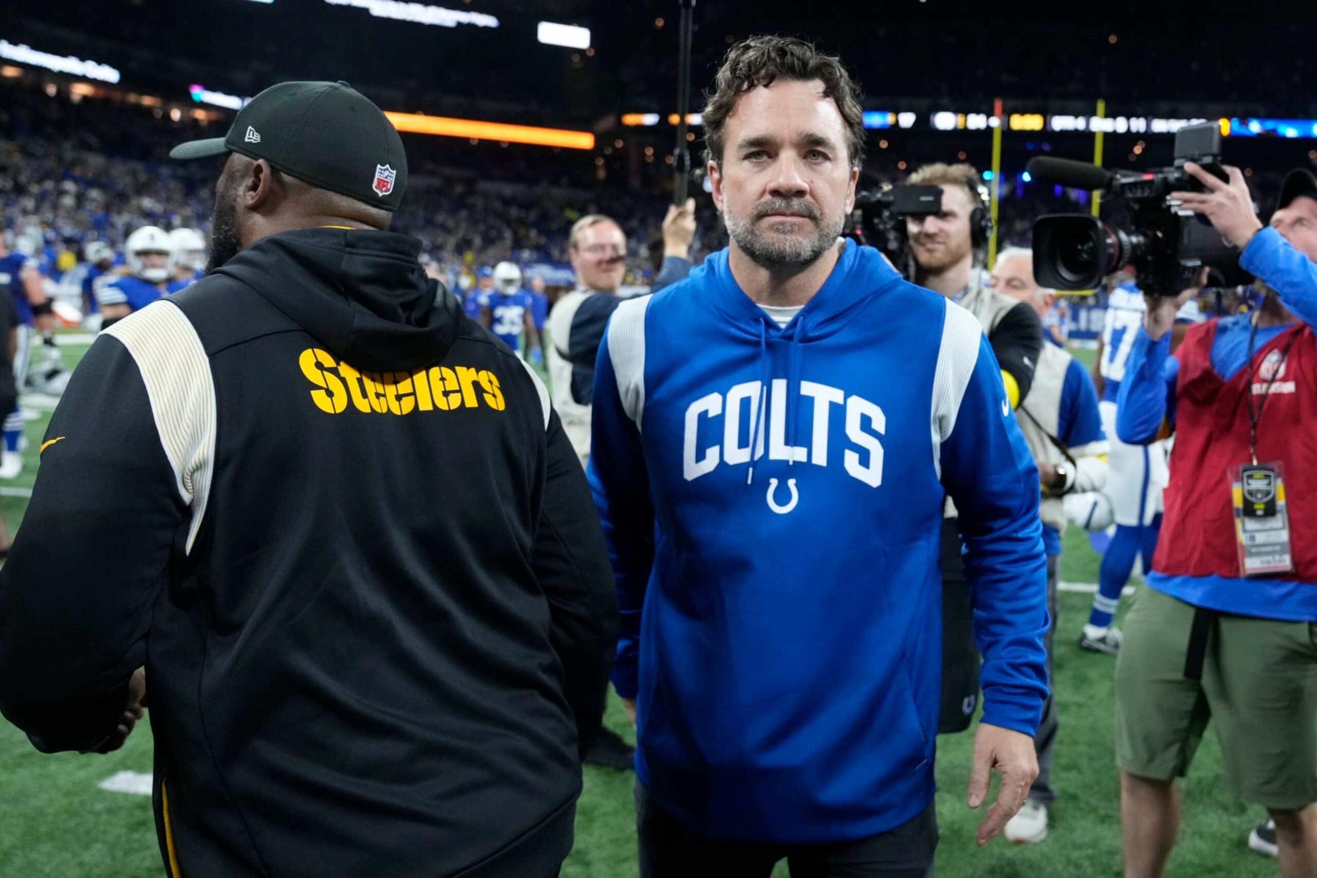 Indianapolis Colts interim head coach Jeff Saturday greets Pittsburgh Steelers head coach Mike Tomlin following an NFL football game, Monday, Nov. 28, 2022, in Indianapolis. (AP Photo/Michael Conroy)