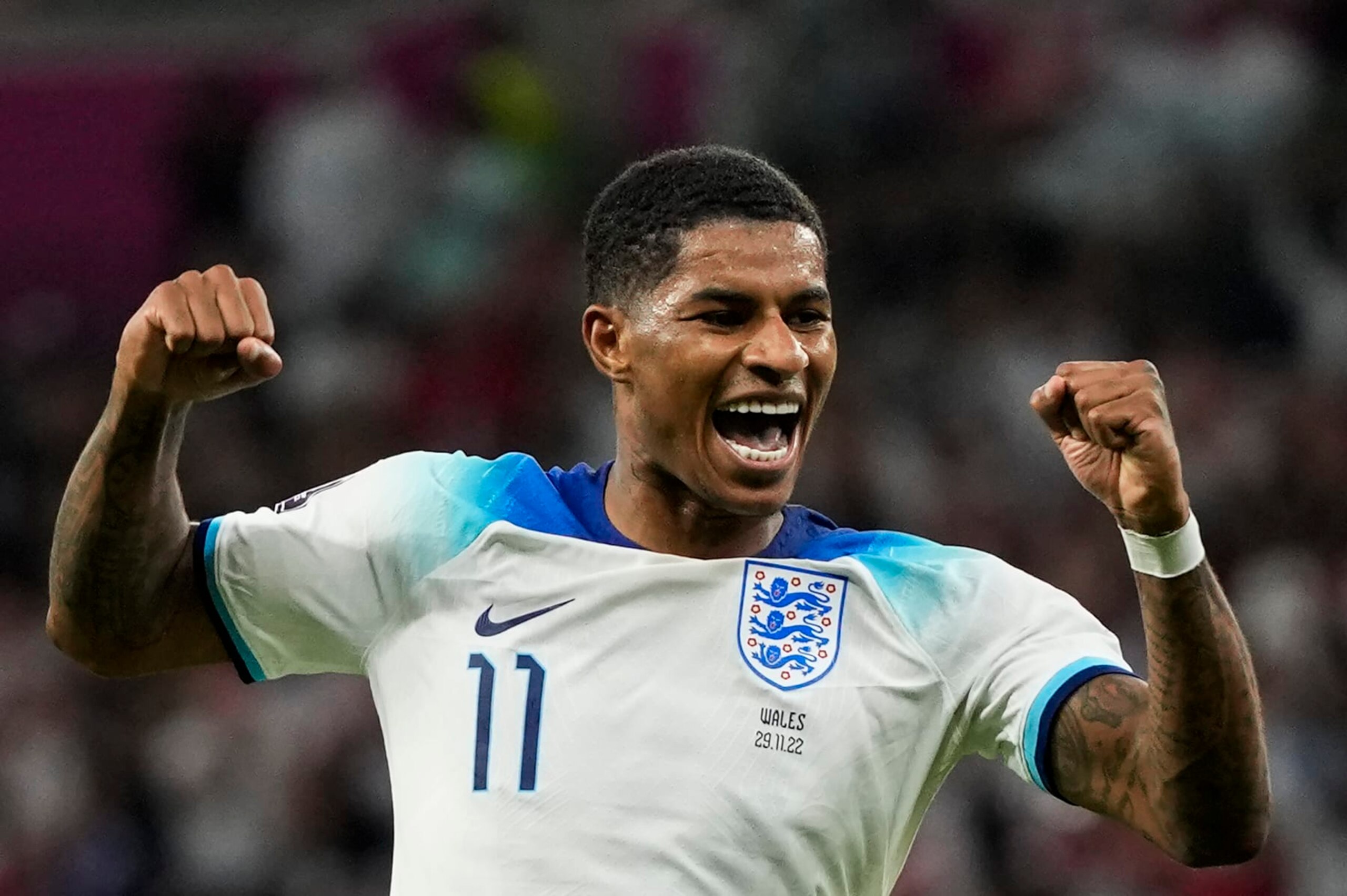 England's Marcus Rashford celebrates after scoring his side's third goal during the World Cup group B soccer match between England and Wales, at the Ahmad Bin Ali Stadium in Al Rayyan , Qatar, Tuesday, Nov. 29, 2022. (AP Photo/Frank Augstein)