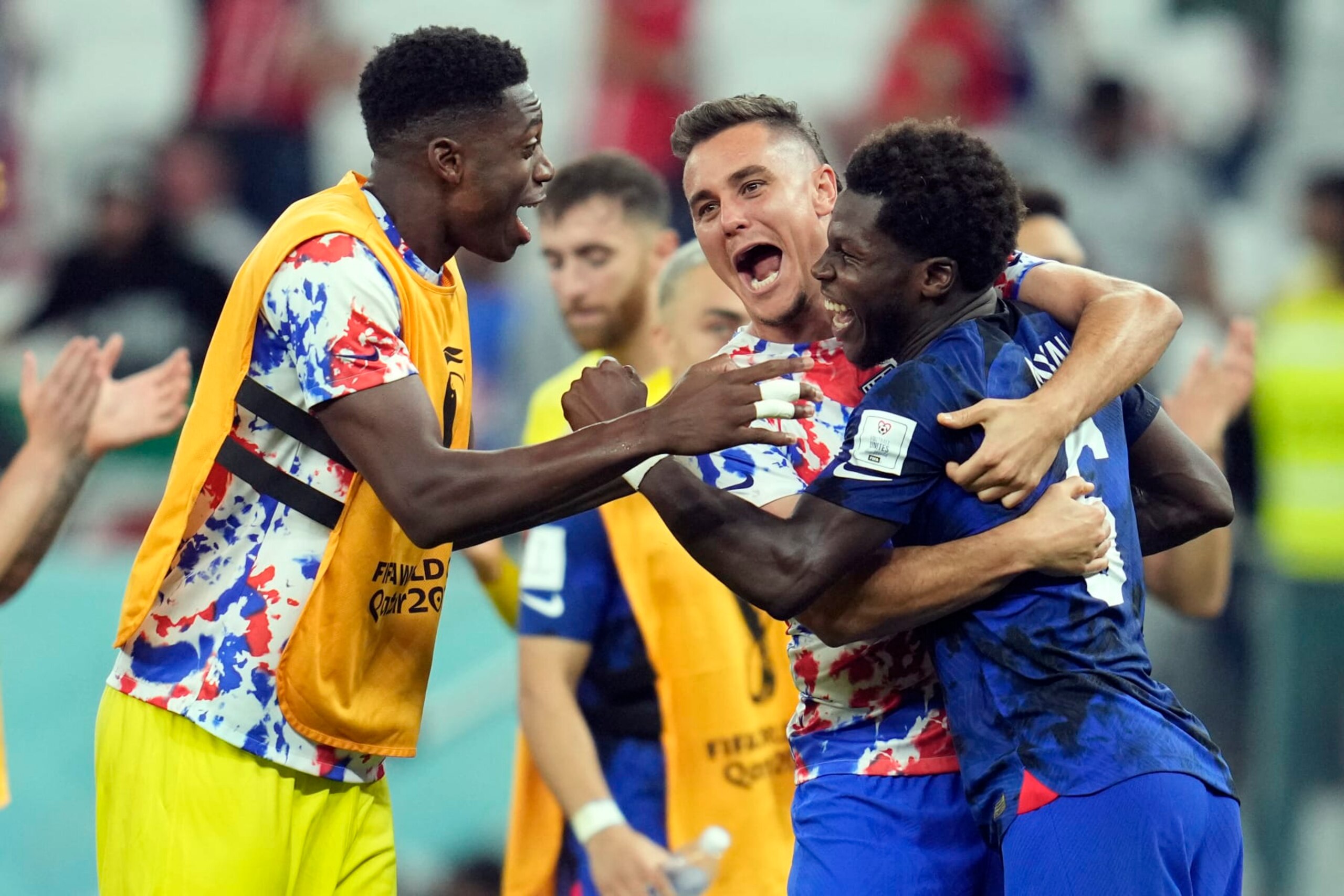United States' Yunus Musah, right, Aaron Long, center, and United States' goalkeeper Sean Johnson celebrate after defeating Iran in the World Cup group B soccer match between Iran and the United States at the Al Thumama Stadium in Doha, Qatar, Tuesday, Nov. 29, 2022. (AP Photo/Ashley Landis) United States' Yunus Musah, right, Aaron Long, center, and United States' goalkeeper Sean Johnson celebrate after defeating Iran in the World Cup group B soccer match between Iran and the United States at the Al Thumama Stadium in Doha, Qatar, Tuesday, Nov. 29, 2022. (AP Photo/Ashley Landis)