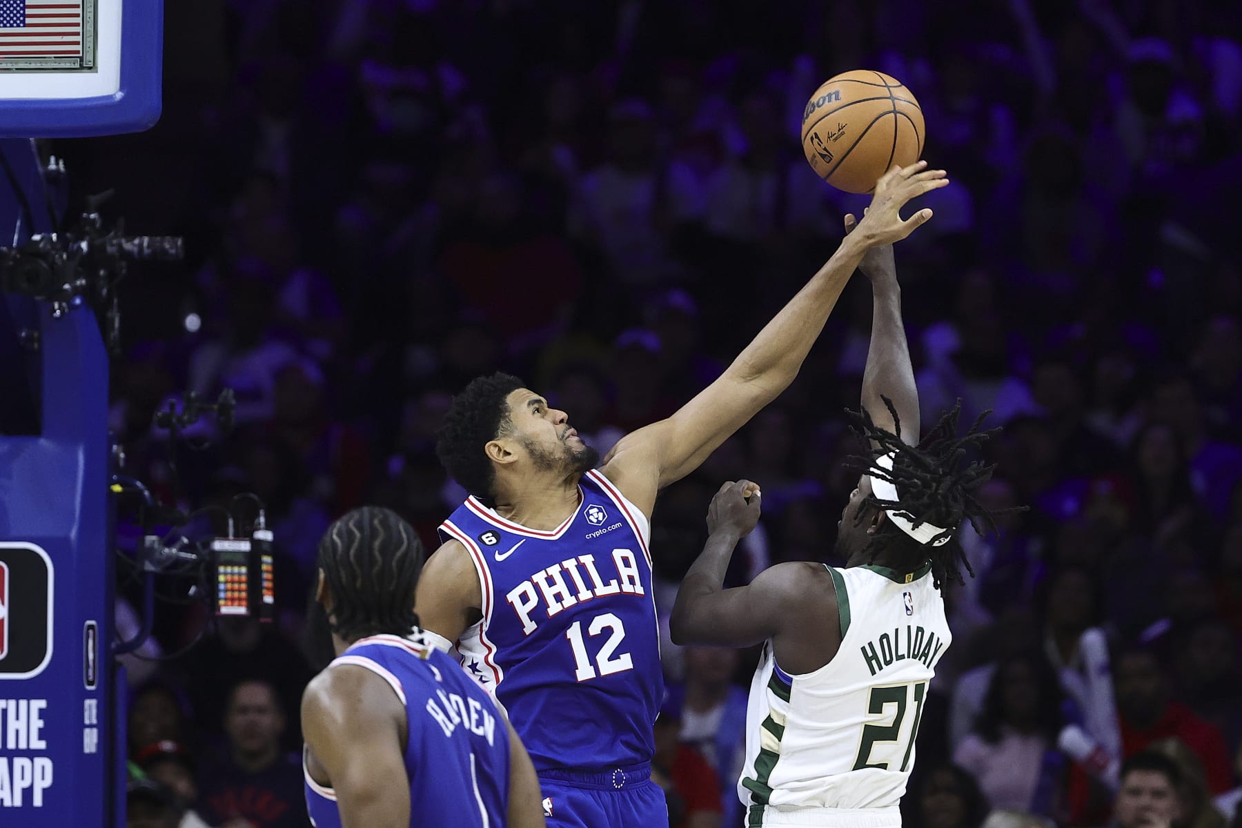 PHILADELPHIA, PENNSYLVANIA - OCTOBER 20: Tobias Harris #12 of the Philadelphia 76ers blocks Jrue Holiday #21 of the Milwaukee Bucks during the fourth quarter at Wells Fargo Center on October 20, 2022 in Philadelphia, Pennsylvania. NOTE TO USER: User expressly acknowledges and agrees that, by downloading and or using this photograph, User is consenting to the terms and conditions of the Getty Images License Agreement. (Photo by Tim Nwachukwu/Getty Images)