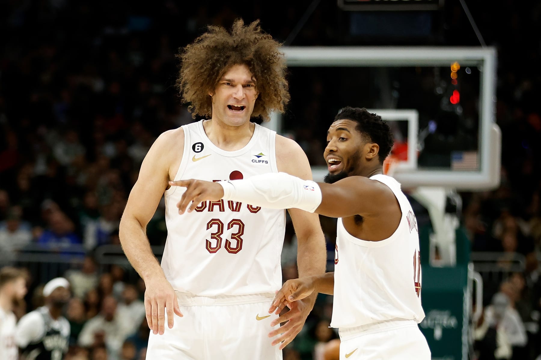 MILWAUKEE, WISCONSIN - NOVEMBER 25: Donovan Mitchell #45 talks with Robin Lopez #33 of the Cleveland Cavaliers during the first half of the game against the Milwaukee Bucks at Fiserv Forum on November 25, 2022 in Milwaukee, Wisconsin. NOTE TO USER: User expressly acknowledges and agrees that, by downloading and or using this photograph, User is consenting to the terms and conditions of the Getty Images License Agreement. (Photo by John Fisher/Getty Images)