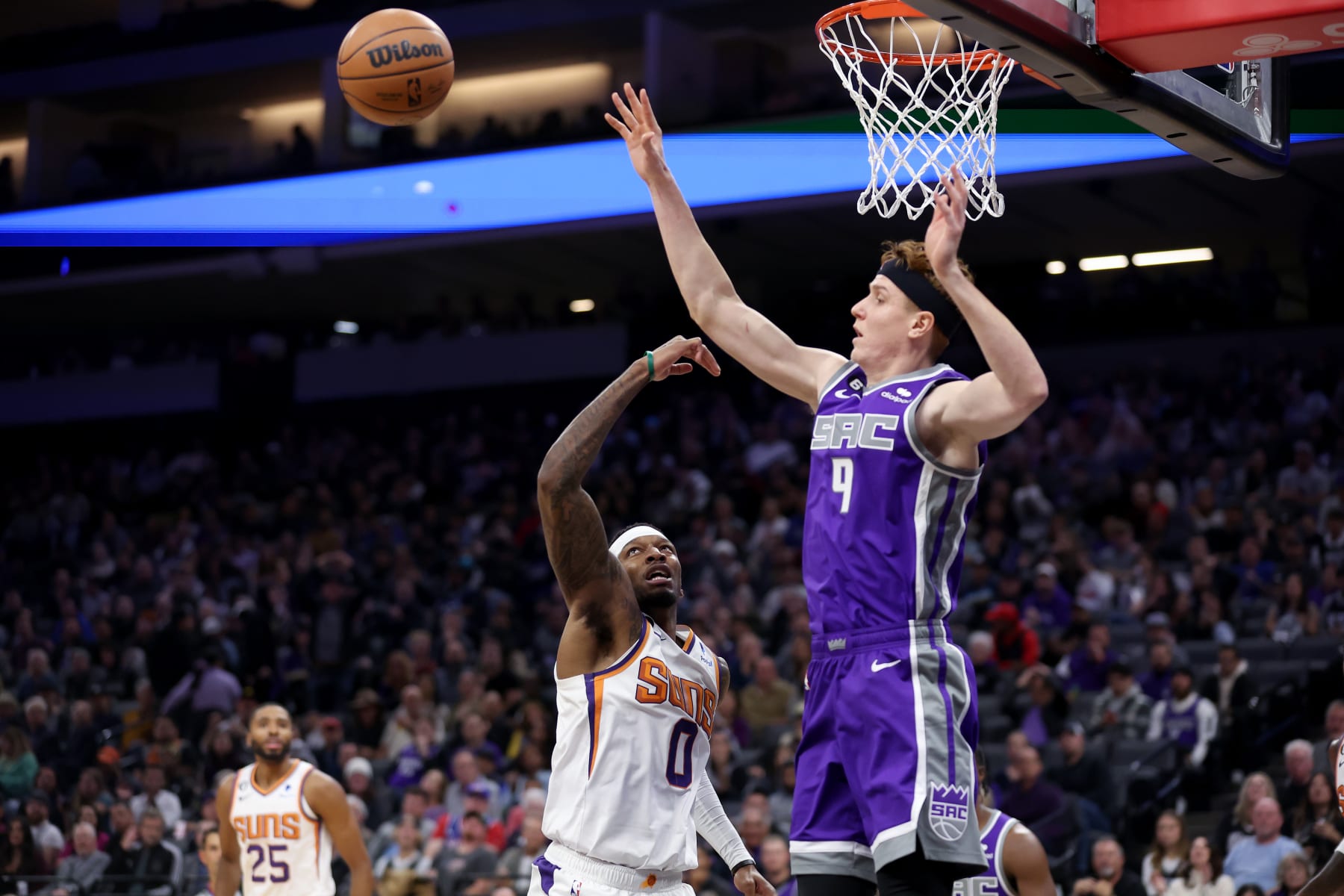 SACRAMENTO, CALIFORNIA - NOVEMBER 28: Kevin Huerter #9 of the Sacramento Kings blocks a shot taken by Torrey Craig #0 of the Phoenix Suns at Golden 1 Center on November 28, 2022 in Sacramento, California. NOTE TO USER: User expressly acknowledges and agrees that, by downloading and or using this photograph, User is consenting to the terms and conditions of the Getty Images License Agreement.  (Photo by Ezra Shaw/Getty Images)