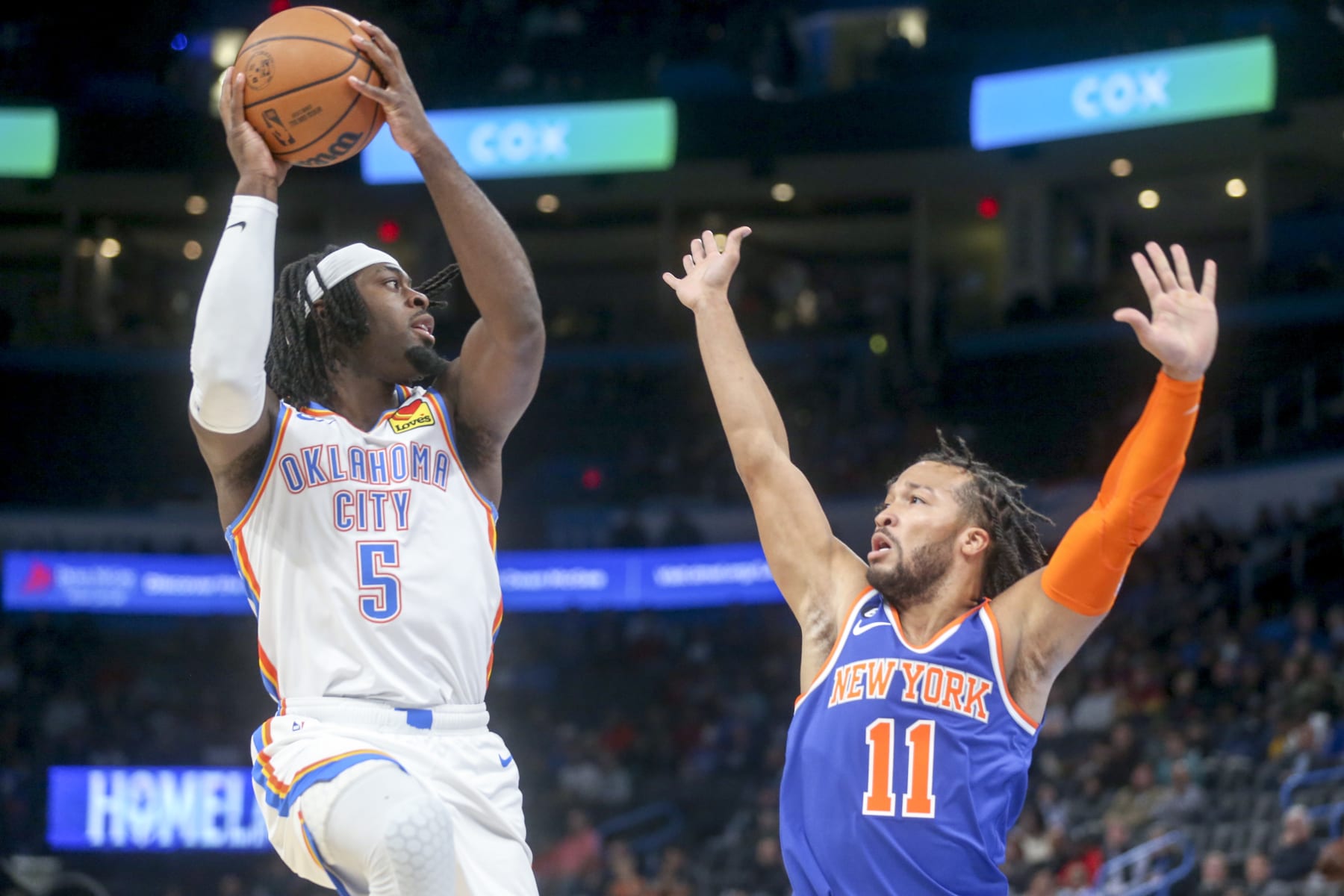 OKLAHOMA CITY, OKLAHOMA - NOVEMBER 21: Luguentz Dort #5 of the Oklahoma City Thunder shoots over Jalen Brunson #11 of the New York Knicks during the first quarter at Paycom Center on November 21, 2022 in Oklahoma City, Oklahoma. NOTE TO USER: User expressly acknowledges and agrees that, by downloading and or using this photograph, User is consenting to the terms and conditions of the Getty Images License Agreement.  (Photo by Ian Maule/Getty Images)