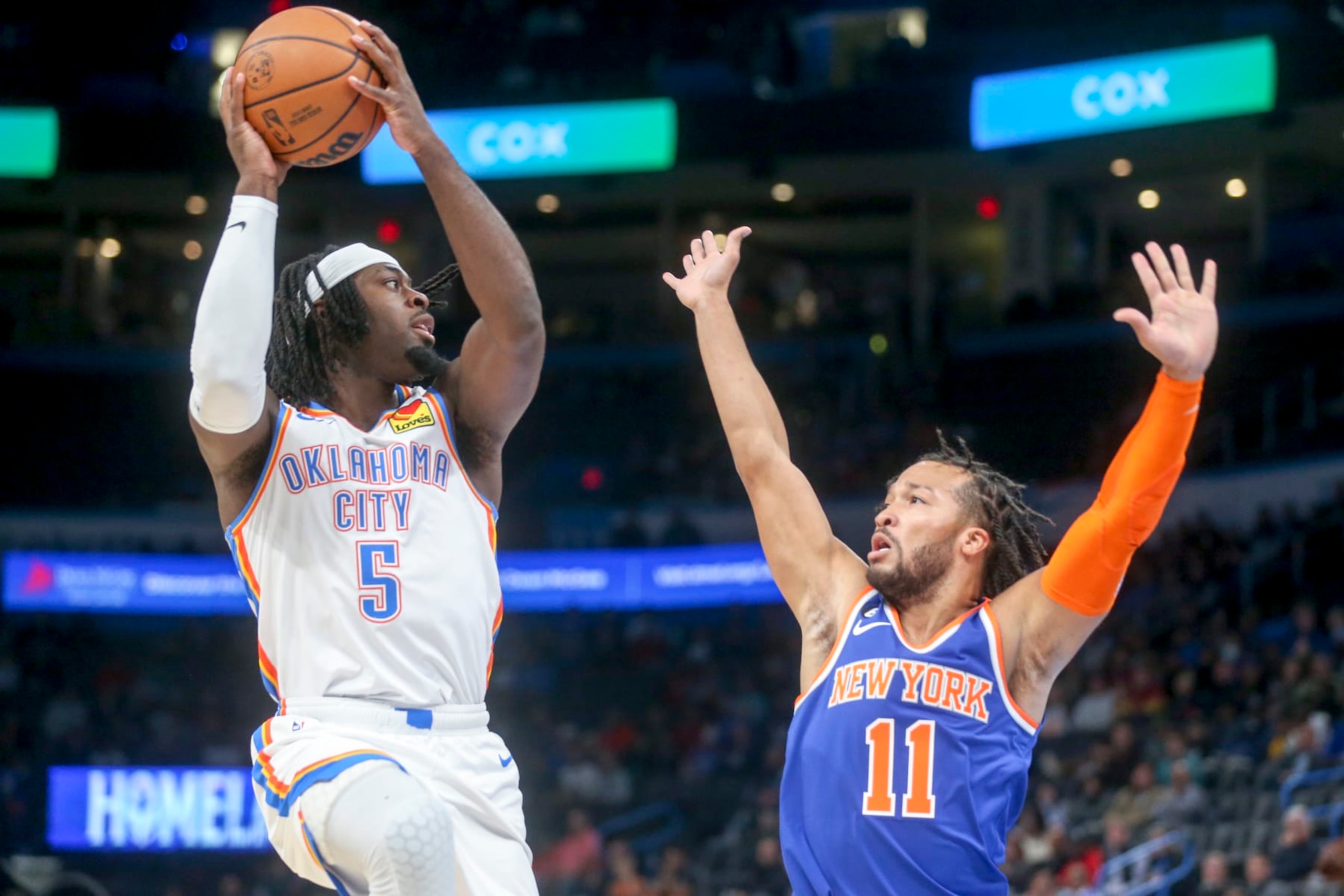 OKLAHOMA CITY, OKLAHOMA - NOVEMBER 21: Luguentz Dort #5 of the Oklahoma City Thunder shoots over Jalen Brunson #11 of the New York Knicks during the first quarter at Paycom Center on November 21, 2022 in Oklahoma City, Oklahoma. NOTE TO USER: User expressly acknowledges and agrees that, by downloading and or using this photograph, User is consenting to the terms and conditions of the Getty Images License Agreement.  (Photo by Ian Maule/Getty Images)