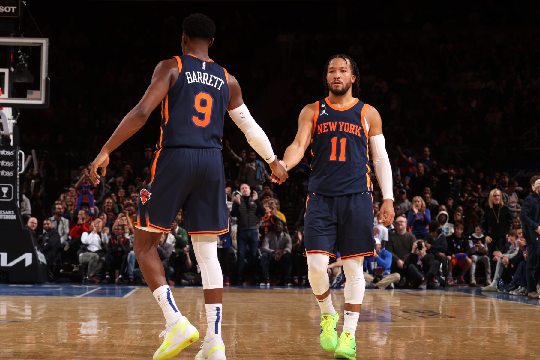 NEW YORK, NY - NOVEMBER 27: Jalen Brunson #11 high fives RJ Barrett #9 of the New York Knicks during the game against the Memphis Grizzlies on November 27, 2022 at Madison Square Garden in New York City, New York.  NOTE TO USER: User expressly acknowledges and agrees that, by downloading and or using this photograph, User is consenting to the terms and conditions of the Getty Images License Agreement. Mandatory Copyright Notice: Copyright 2022 NBAE  (Photo by Nathaniel S. Butler/NBAE via Getty Images)
