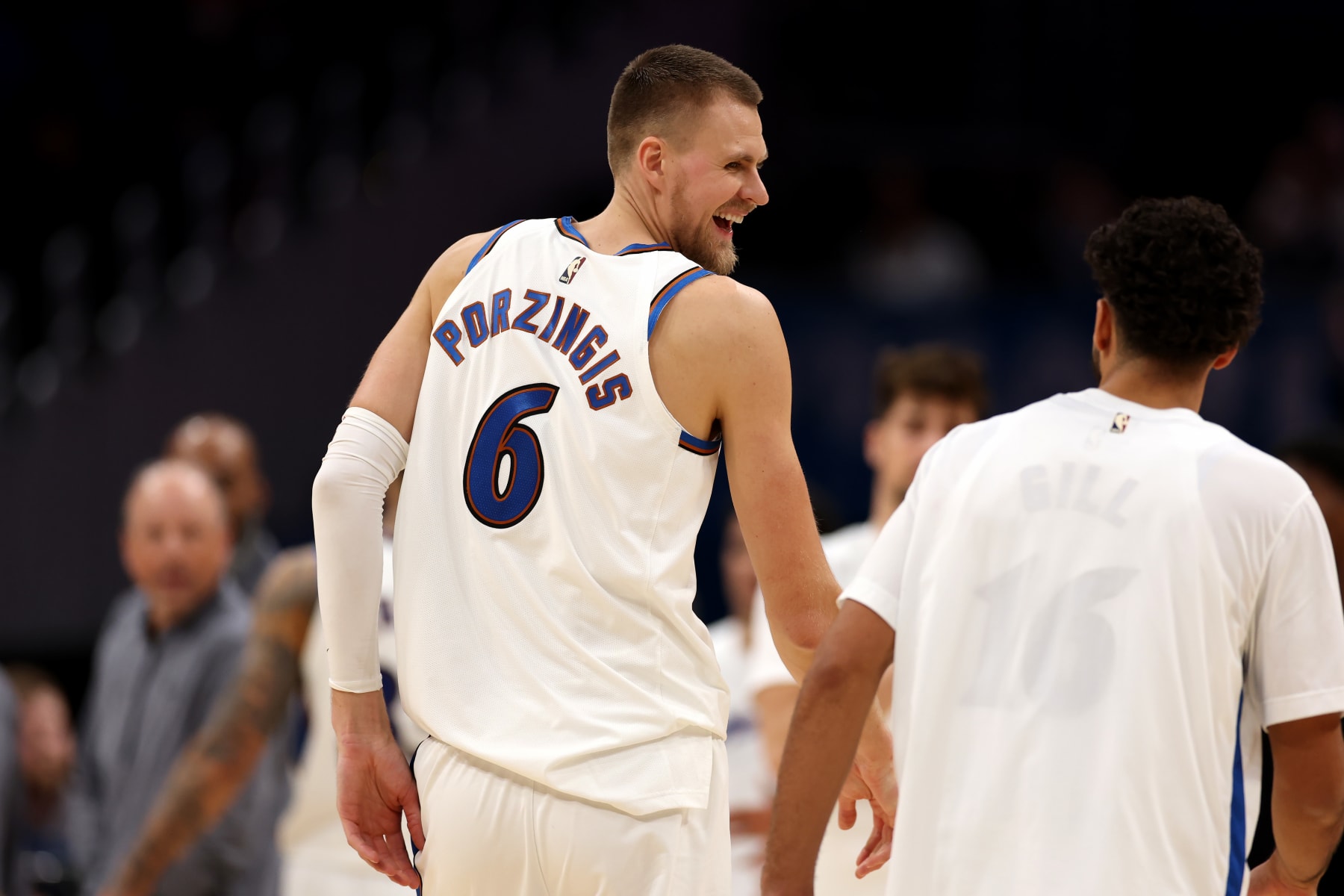 WASHINGTON, DC - NOVEMBER 28: Kristaps Porzingis #6 of the Washington Wizards talks with Anthony Gill #16 during a second half timeout against the Minnesota Timberwolves at Capital One Arena on November 28, 2022 in Washington, DC. NOTE TO USER: User expressly acknowledges and agrees that, by downloading and or using this photograph, User is consenting to the terms and conditions of the Getty Images License Agreement. (Photo by Rob Carr/Getty Images)
