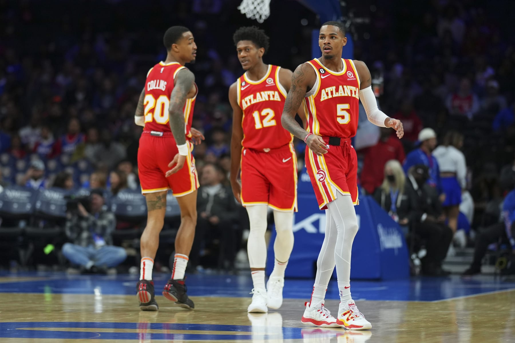 PHILADELPHIA, PA - NOVEMBER 28: John Collins #20, De'Andre Hunter #12, and Dejounte Murray #5 of the Atlanta Hawks look on against the Philadelphia 76ers at the Wells Fargo Center on November 28, 2022 in Philadelphia, Pennsylvania. NOTE TO USER: User expressly acknowledges and agrees that, by downloading and or using this photograph, User is consenting to the terms and conditions of the Getty Images License Agreement. (Photo by Mitchell Leff/Getty Images)