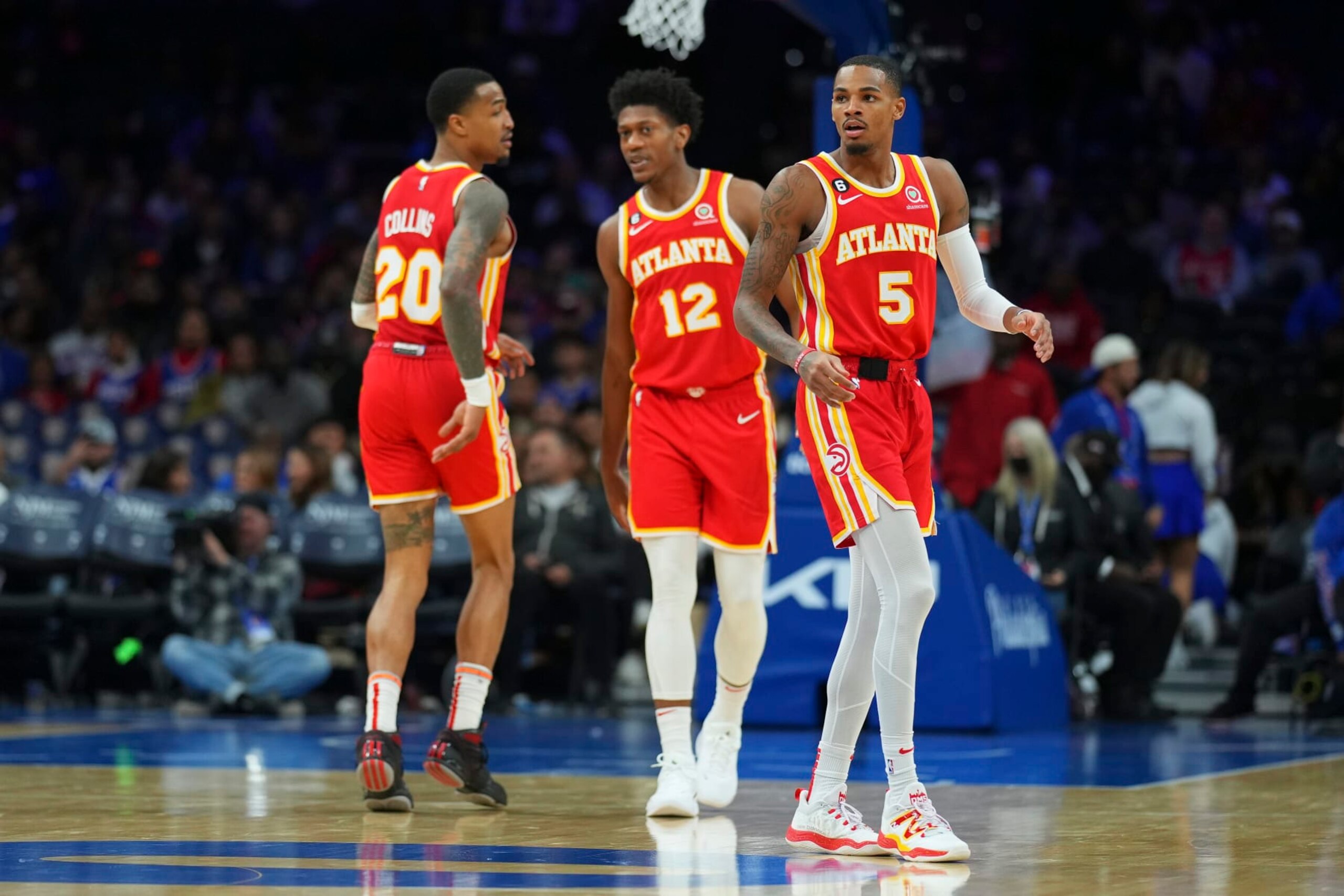 PHILADELPHIA, PA - NOVEMBER 28: John Collins #20, De'Andre Hunter #12, and Dejounte Murray #5 of the Atlanta Hawks look on against the Philadelphia 76ers at the Wells Fargo Center on November 28, 2022 in Philadelphia, Pennsylvania. NOTE TO USER: User expressly acknowledges and agrees that, by downloading and or using this photograph, User is consenting to the terms and conditions of the Getty Images License Agreement. (Photo by Mitchell Leff/Getty Images)