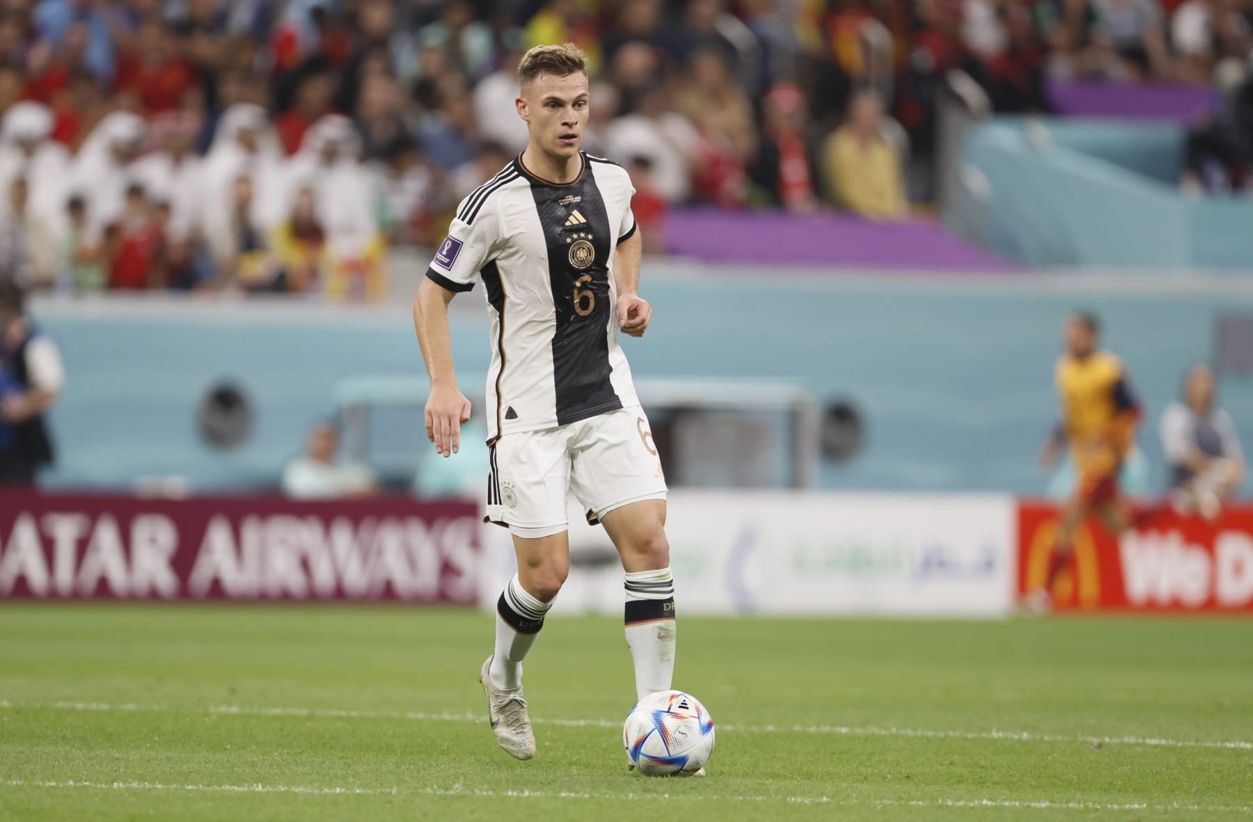 AL KHOR, QATAR - NOVEMBER 27: Joshua Kimmich of Germany on the ball during the FIFA World Cup Qatar 2022 Group E match between Spain and Germany at Al Bayt Stadium on November 27, 2022 in Al Khor, Qatar. (Photo by Richard Sellers/Getty Images)