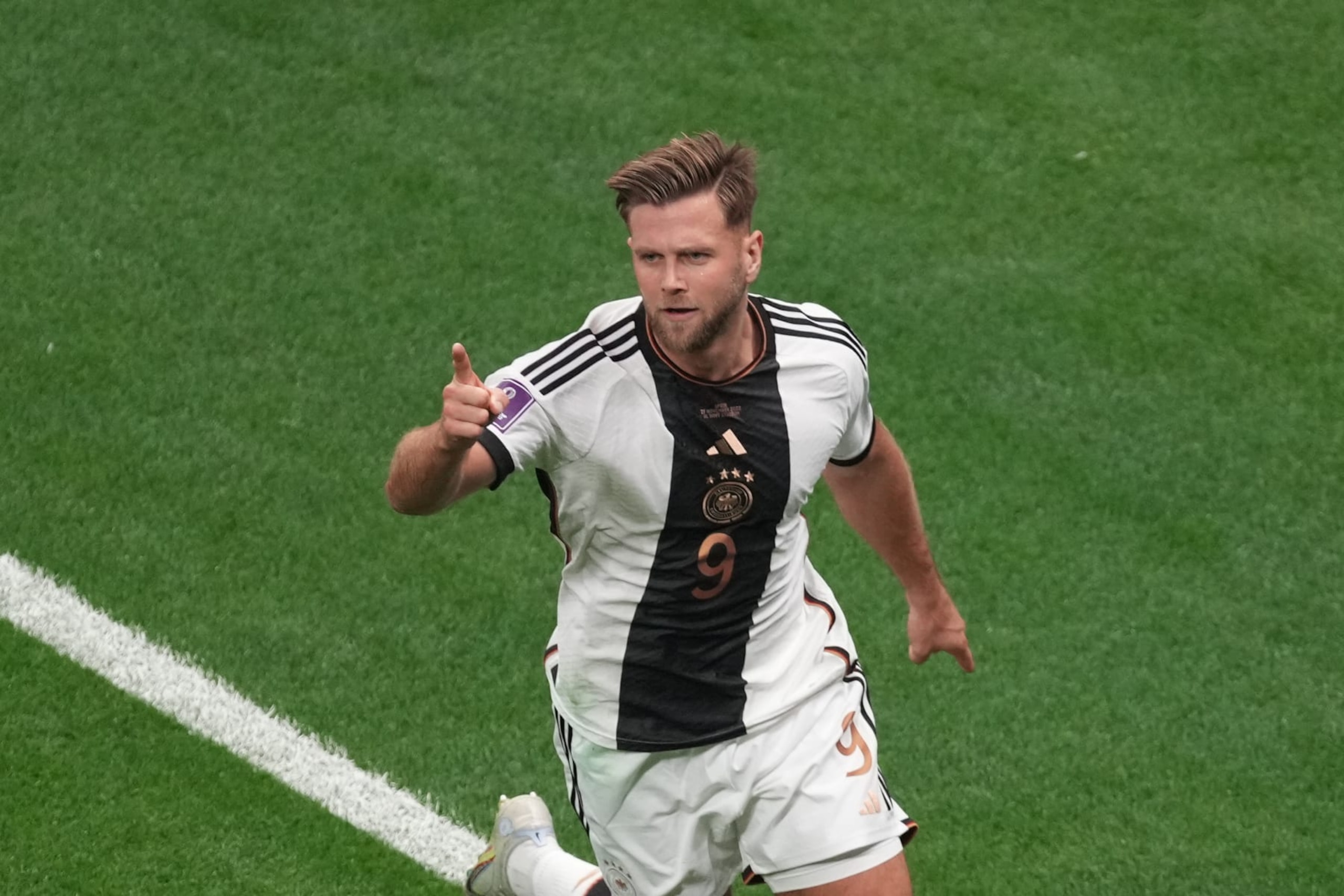 AL KHOR, QATAR - NOVEMBER 27: Niclas Fullkrug (9) of Germany celebrates with his teammates after scoring a goal during the FIFA World Cup Qatar 2022 Group E match between Spain and Germany at Al Bayt Stadium on November 27, 2022 in Al Khor, Qatar. (Photo by Ercin Erturk/Anadolu Agency via Getty Images) AL KHOR, QATAR - NOVEMBER 27: Niclas Fullkrug (9) of Germany celebrates with his teammates after scoring a goal during the FIFA World Cup Qatar 2022 Group E match between Spain and Germany at Al Bayt Stadium on November 27, 2022 in Al Khor, Qatar. (Photo by Ercin Erturk/Anadolu Agency via Getty Images)