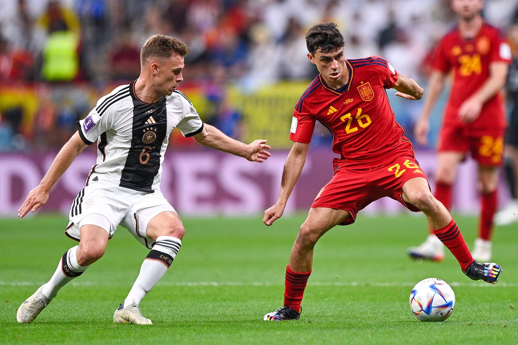 AL KHOR, QATAR - NOVEMBER 28: Joshua Kimmich of Germany and Pedri Gonzalez of Spain during the Group E - FIFA World Cup Qatar 2022 match between Spain and Germany at the Al Bayt Stadium on November 28, 2022 in Al Khor, Qatar (Photo by Pablo Morano/BSR Agency/Getty Images)