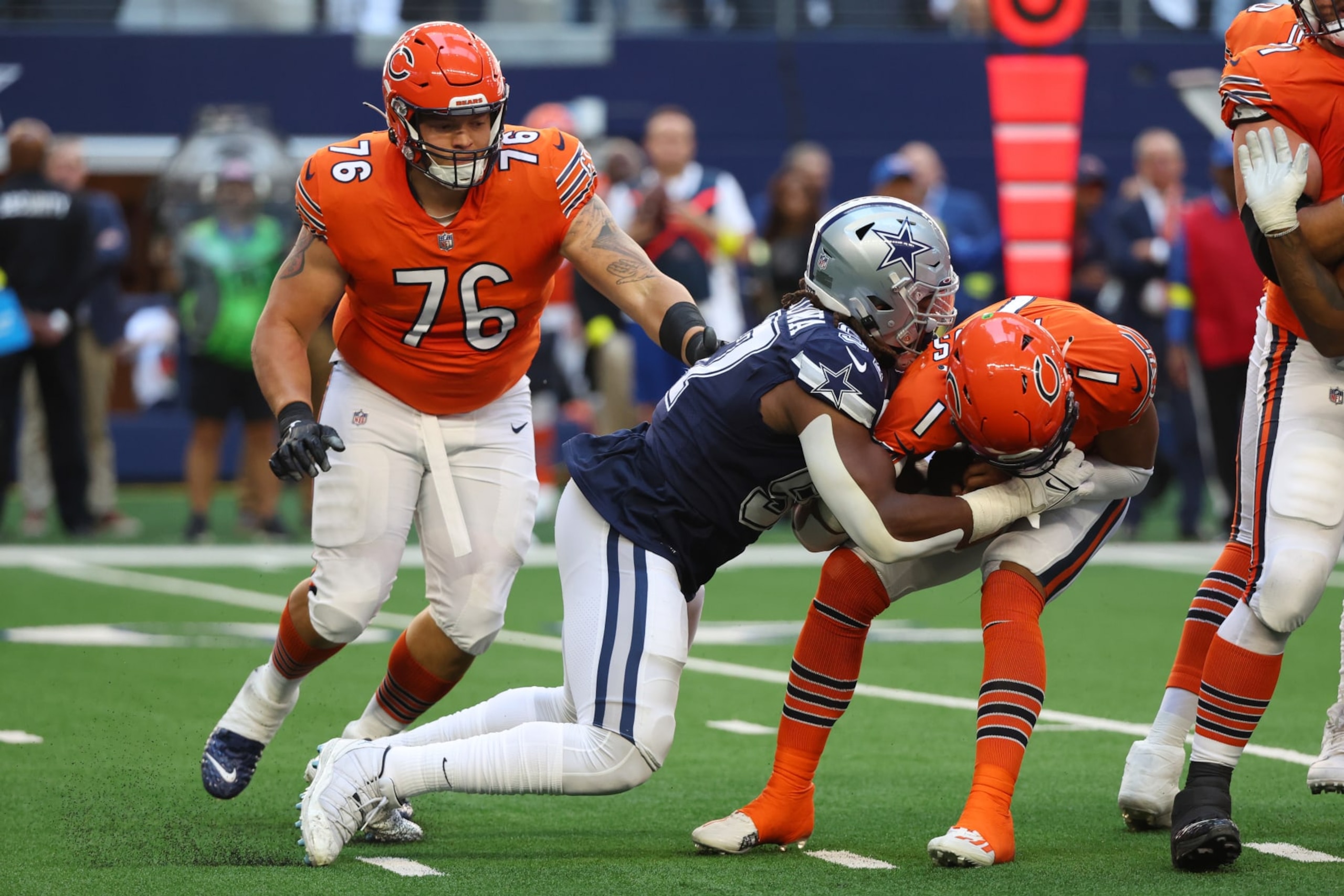 ARLINGTON, TEXAS - OCTOBER 30: Justin Fields #1 of the Chicago Bears is sacked by Osa Odighizuwa #97 of the Dallas Cowboys during the second quarter at AT&T Stadium on October 30, 2022 in Arlington, Texas. (Photo by Richard Rodriguez/Getty Images) ARLINGTON, TEXAS - OCTOBER 30: Justin Fields #1 of the Chicago Bears is sacked by Osa Odighizuwa #97 of the Dallas Cowboys during the second quarter at AT&T Stadium on October 30, 2022 in Arlington, Texas. (Photo by Richard Rodriguez/Getty Images)