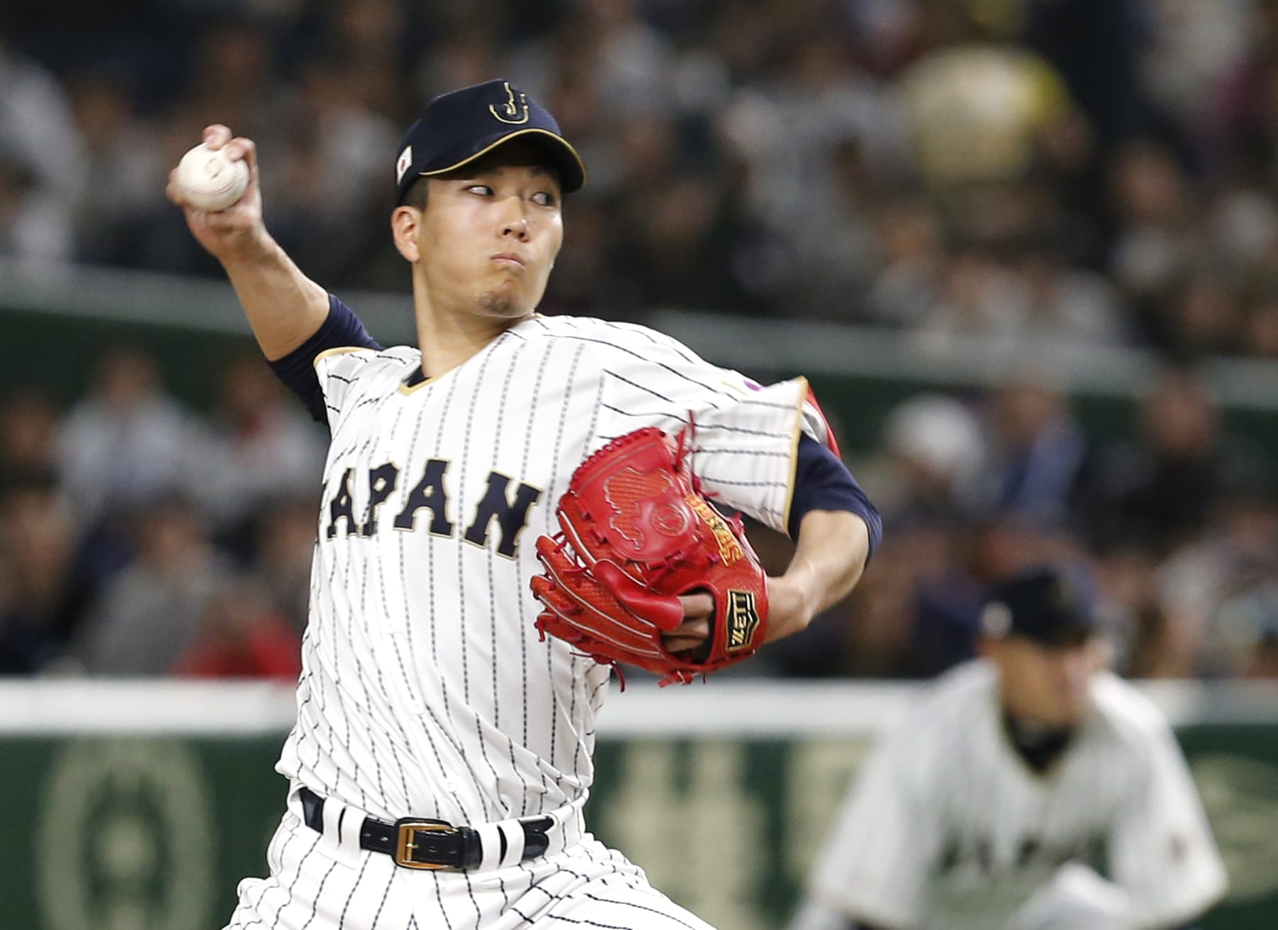 Japan's starter Kodai Senga pitches against Israel during the first inning of their second round game at the World Baseball Classic at Tokyo Dome in Tokyo, Wednesday, March 15, 2017. (AP Photo/Toru Takahashi)