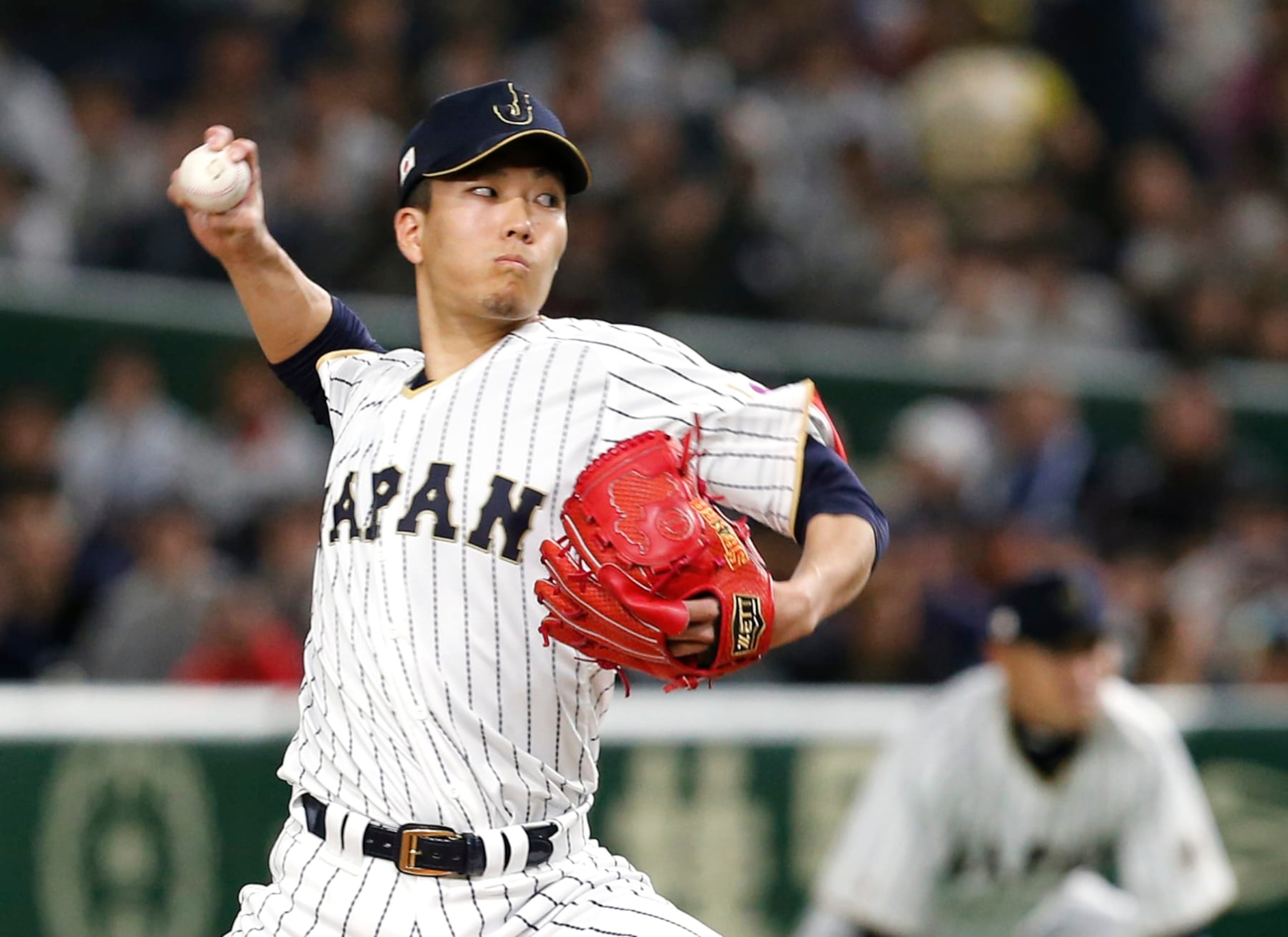 Japan's starter Kodai Senga pitches against Israel during the first inning of their second round game at the World Baseball Classic at Tokyo Dome in Tokyo, Wednesday, March 15, 2017. (AP Photo/Toru Takahashi)