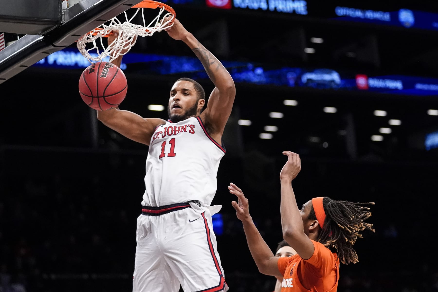 St. John's Joel Soriano (11) dunks in the second half of an NCAA college basketball championship game against Syracuse at the Good Samaritan Empire Classic, Tuesday, Nov. 22, 2022, in New York. (AP Photo/John Minchillo)