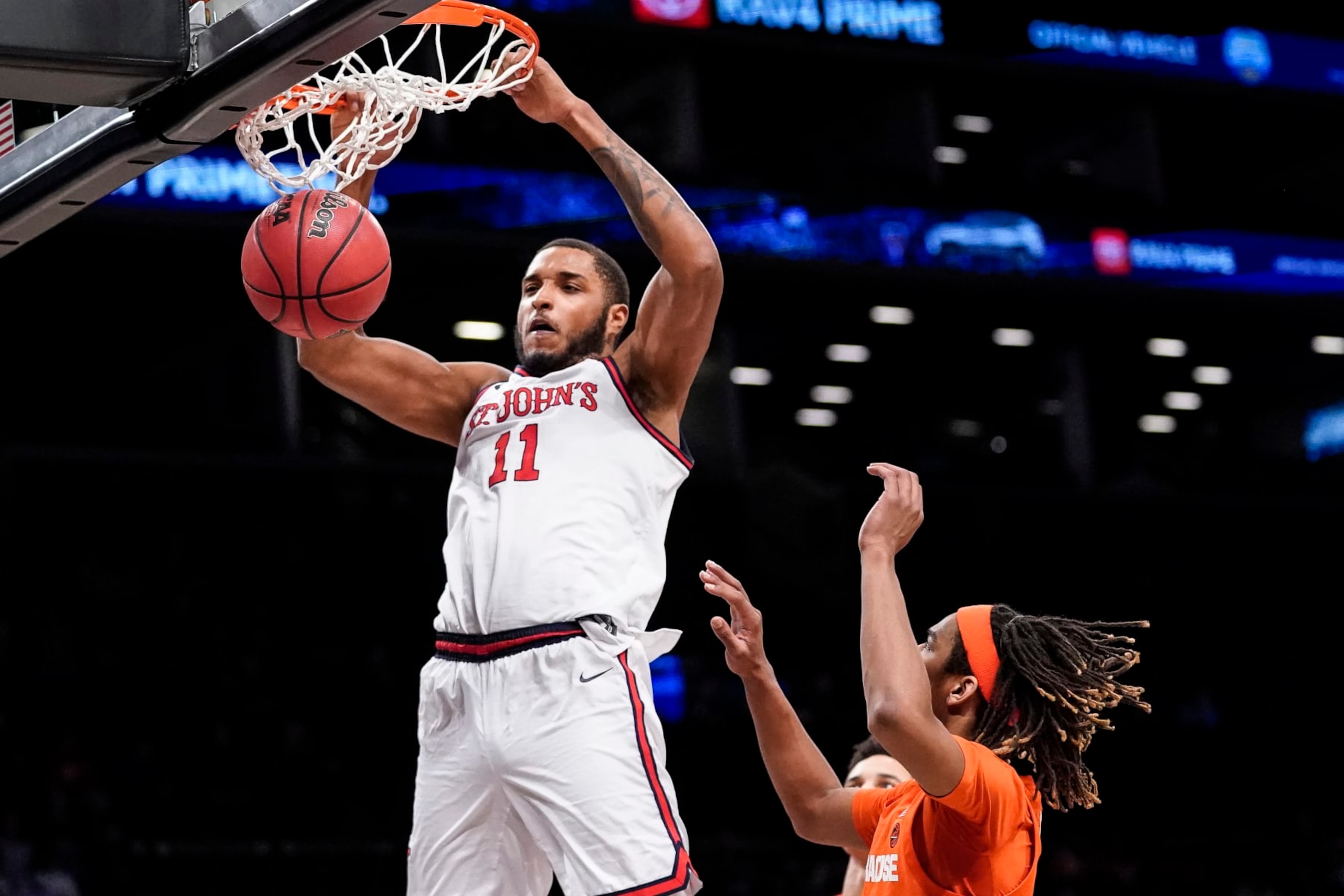 St. John's Joel Soriano (11) dunks in the second half of an NCAA college basketball championship game against Syracuse at the Good Samaritan Empire Classic, Tuesday, Nov. 22, 2022, in New York. (AP Photo/John Minchillo)