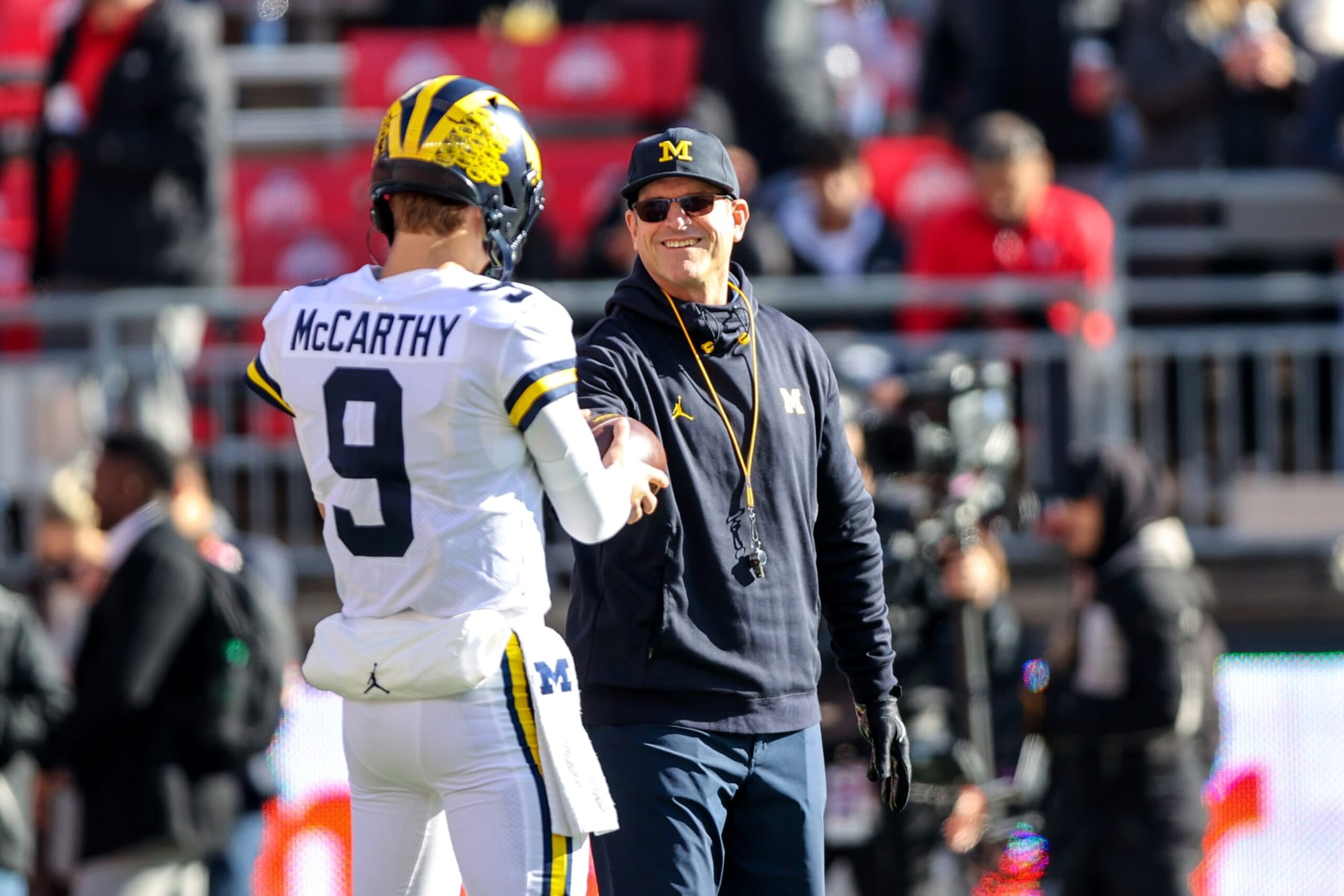 J.J. McCarthy and Jim Harbaugh