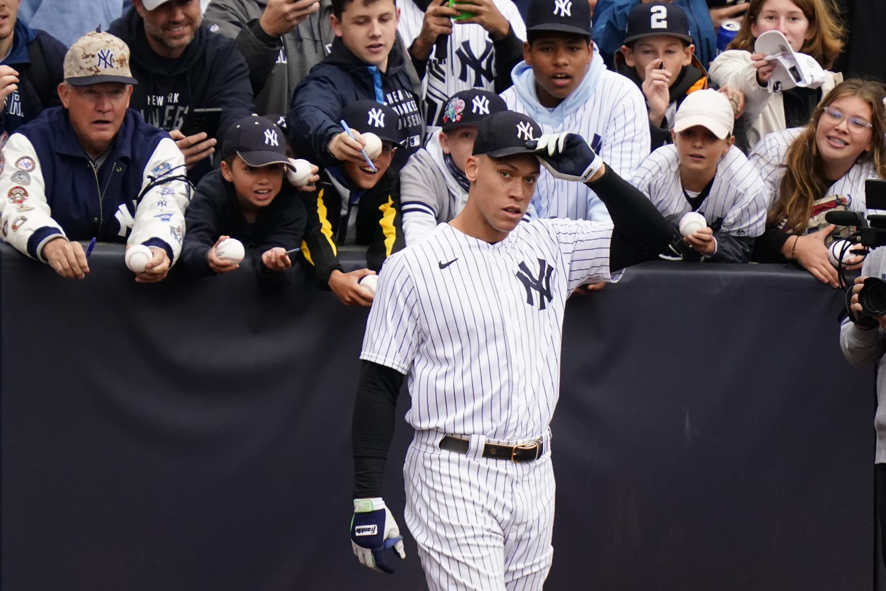 New York Yankees' Aaron Judge removes his hat for the playing of the national anthem before a baseball game against the Baltimore Orioles Sunday, Oct. 2, 2022, in New York. (AP Photo/Frank Franklin II)