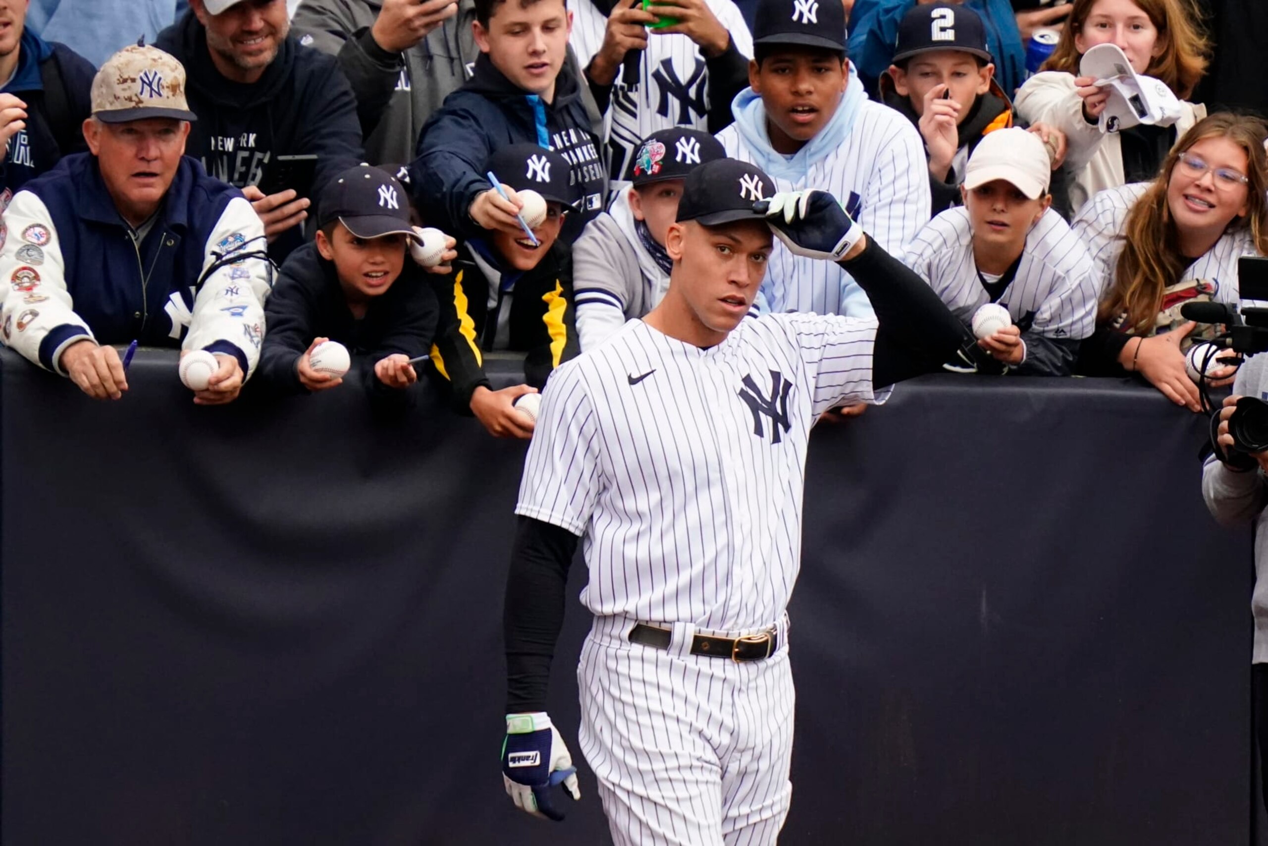 New York Yankees' Aaron Judge removes his hat for the playing of the national anthem before a baseball game against the Baltimore Orioles Sunday, Oct. 2, 2022, in New York. (AP Photo/Frank Franklin II)