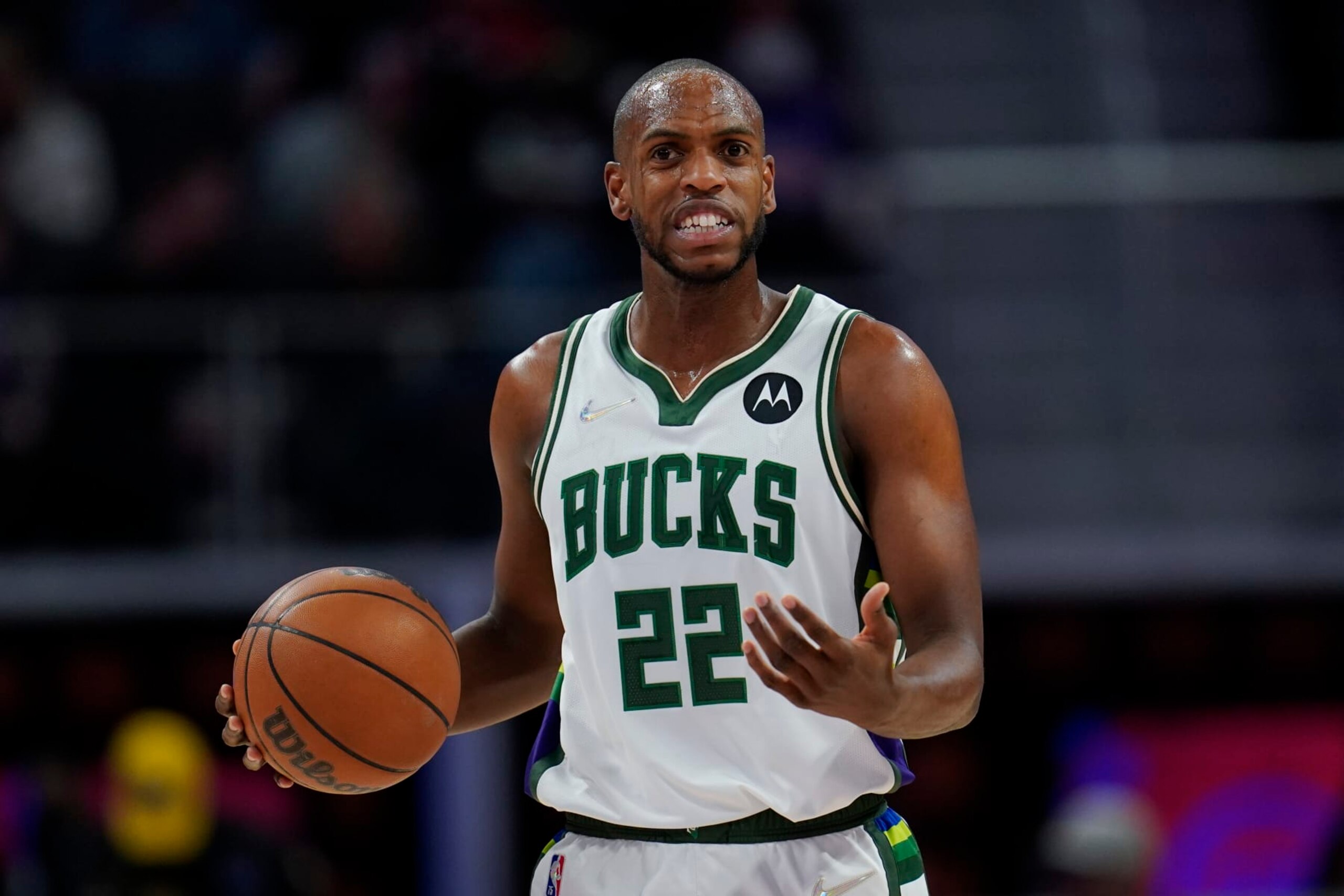 Milwaukee Bucks forward Khris Middleton (22) plays against the Detroit Pistons in the first half of an NBA basketball game in Detroit, Friday, April 8, 2022. (AP Photo/Paul Sancya)