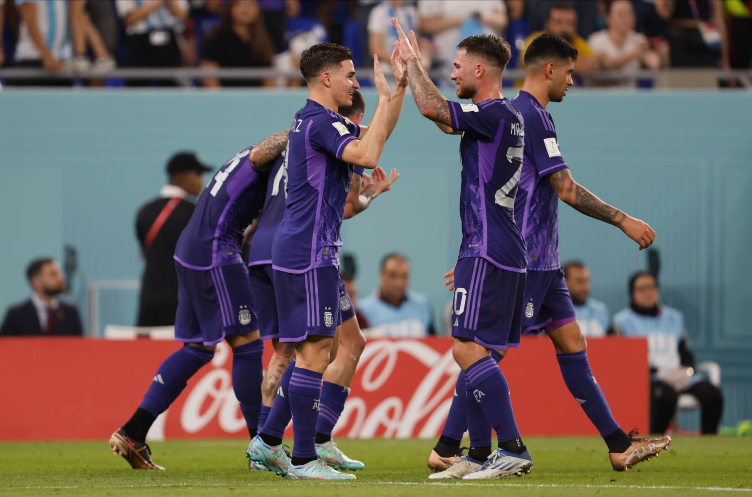 DOHA, QATAR - NOVEMBER 30: Julian Alvarez of Argentina and Alexis Mac Allister of Argentina celebrate during the FIFA World Cup Qatar 2022 Group C match between Poland and Argentina at Stadium 974 on November 30, 2022 in Doha, Qatar. (Photo by Richard Sellers/Getty Images)