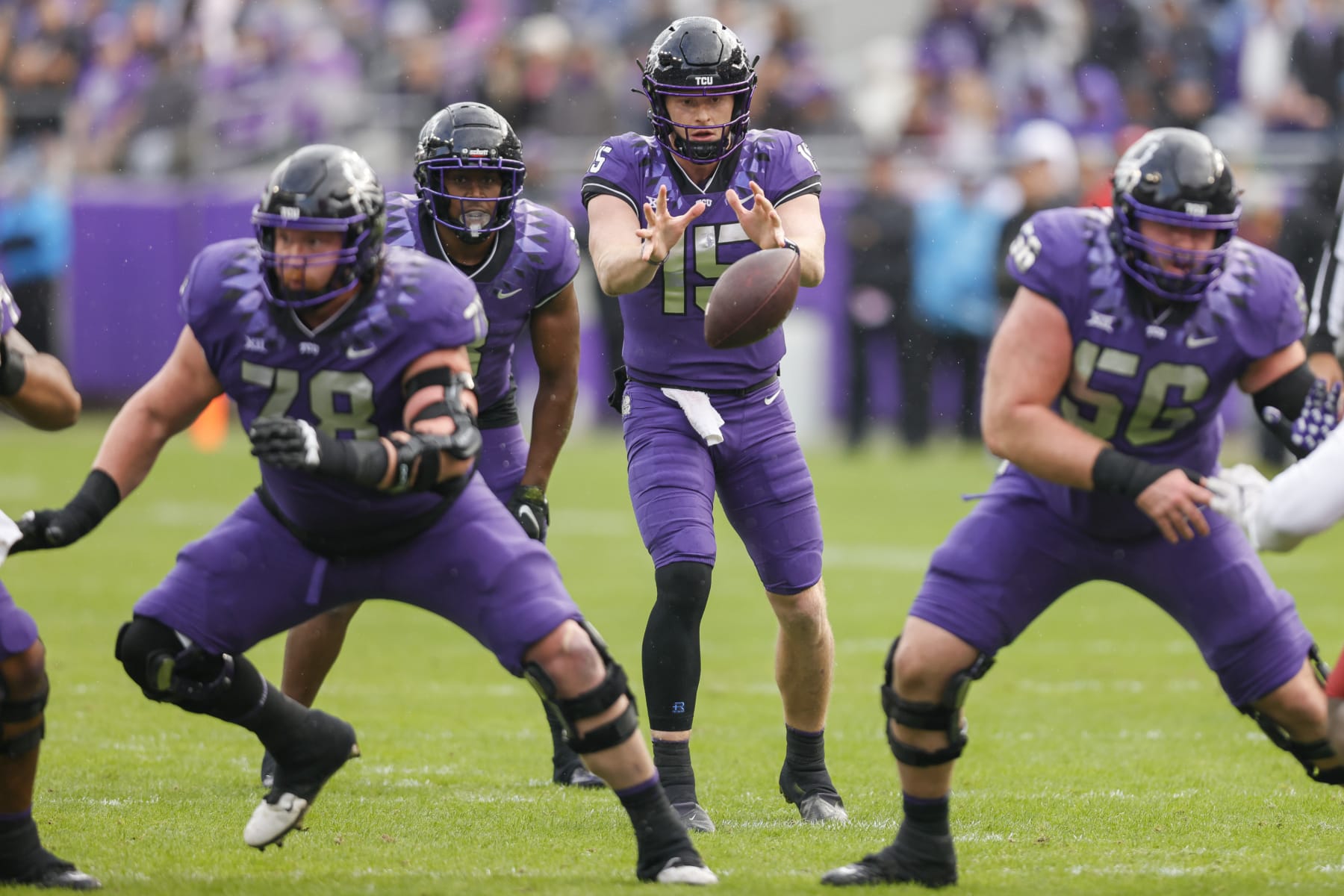 FORT WORTH, TX - NOVEMBER 26: TCU Horned Frogs quarterback Max Duggan (15) takes the snap from center during the game between the TCU Horned Frogs and the Iowa State Cyclones on November 26, 2022 at Amon G. Carter Stadium in Fort Worth, Texas. (Photo by Matthew Pearce/Icon Sportswire via Getty Images)