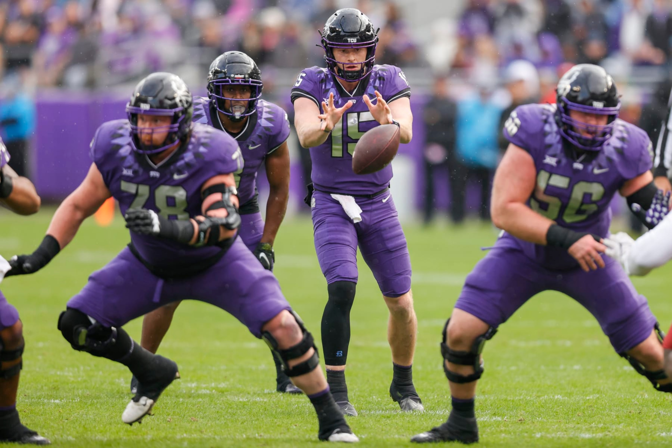 FORT WORTH, TX - NOVEMBER 26: TCU Horned Frogs quarterback Max Duggan (15) takes the snap from center during the game between the TCU Horned Frogs and the Iowa State Cyclones on November 26, 2022 at Amon G. Carter Stadium in Fort Worth, Texas. (Photo by Matthew Pearce/Icon Sportswire via Getty Images) FORT WORTH, TX - NOVEMBER 26: TCU Horned Frogs quarterback Max Duggan (15) takes the snap from center during the game between the TCU Horned Frogs and the Iowa State Cyclones on November 26, 2022 at Amon G. Carter Stadium in Fort Worth, Texas. (Photo by Matthew Pearce/Icon Sportswire via Getty Images)