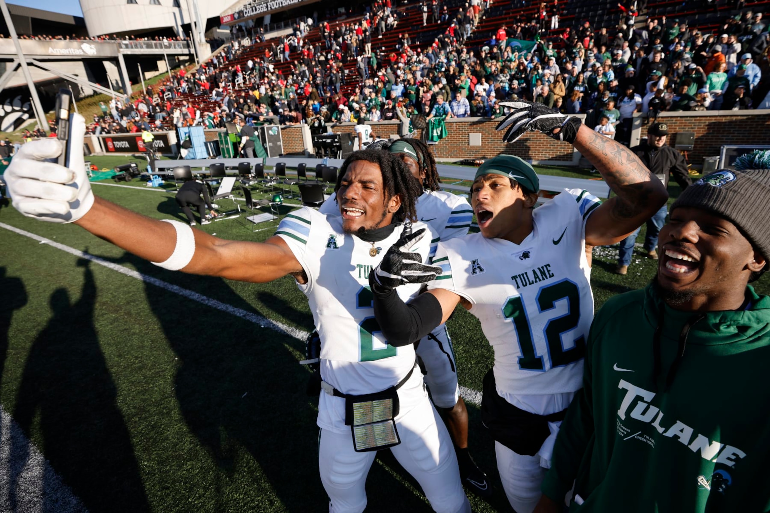 CINCINNATI, OH - NOVEMBER 25: Tulane Green Wave wide receiver Duece Watts (2) and cornerback DJ Douglas (12) celebrate after defeating the Cincinnati Bearcats during a college football game on November 25, 2022 at Nippert Stadium in Cincinnati, Ohio. (Photo by Joe Robbins/Icon Sportswire via Getty Images) CINCINNATI, OH - NOVEMBER 25: Tulane Green Wave wide receiver Duece Watts (2) and cornerback DJ Douglas (12) celebrate after defeating the Cincinnati Bearcats during a college football game on November 25, 2022 at Nippert Stadium in Cincinnati, Ohio. (Photo by Joe Robbins/Icon Sportswire via Getty Images)