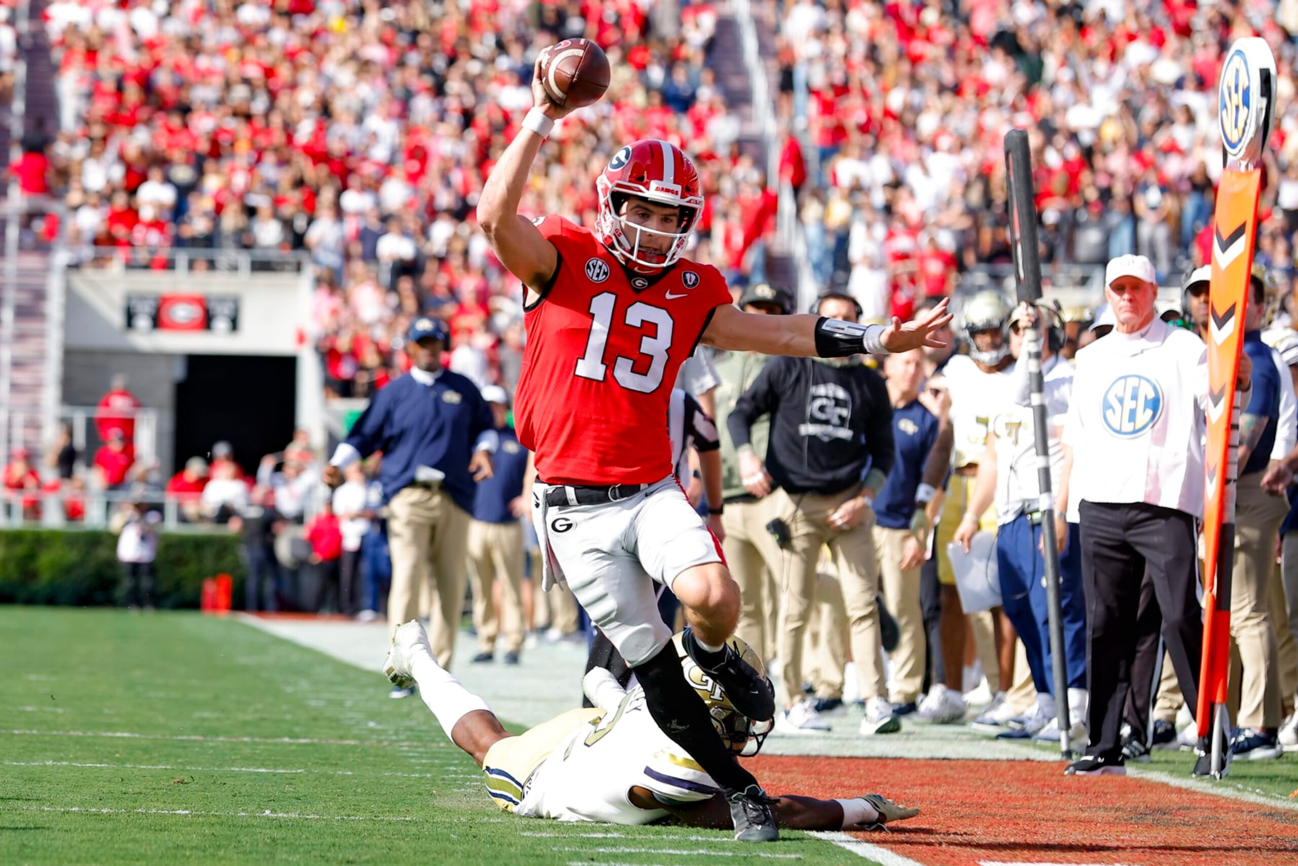 ATHENS, GA - NOVEMBER 26: Stetson Bennett #13 of the Georgia Bulldogs scrambles in the first half against the Georgia Tech Yellow Jackets at Sanford Stadium on November 26, 2022 in Athens, Georgia. (Photo by Todd Kirkland/Getty Images) ATHENS, GA - NOVEMBER 26: Stetson Bennett #13 of the Georgia Bulldogs scrambles in the first half against the Georgia Tech Yellow Jackets at Sanford Stadium on November 26, 2022 in Athens, Georgia. (Photo by Todd Kirkland/Getty Images)