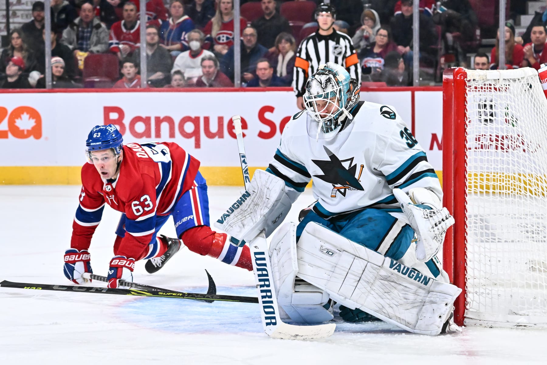 MONTREAL, CANADA - NOVEMBER 29:  Goaltender Kaapo Kahkonen #36 of the San Jose Sharks gets down on his pads near Evgenii Dadonov #63 of the Montreal Canadiens during the second period at Centre Bell on November 29, 2022 in Montreal, Quebec, Canada.  (Photo by Minas Panagiotakis/Getty Images)