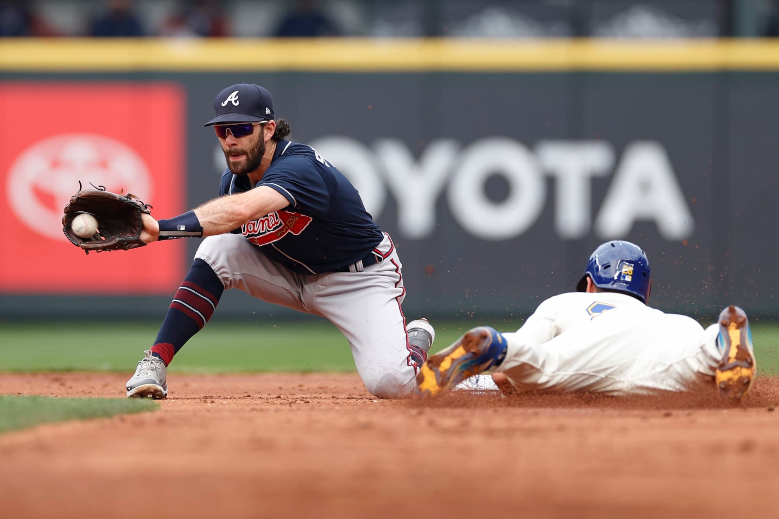 SEATTLE, WASHINGTON - SEPTEMBER 11: Adam Frazier #26 of the Seattle Mariners steals second base against Dansby Swanson #7 of the Atlanta Braves during the second inningat T-Mobile Park on September 11, 2022 in Seattle, Washington. (Photo by Steph Chambers/Getty Images)