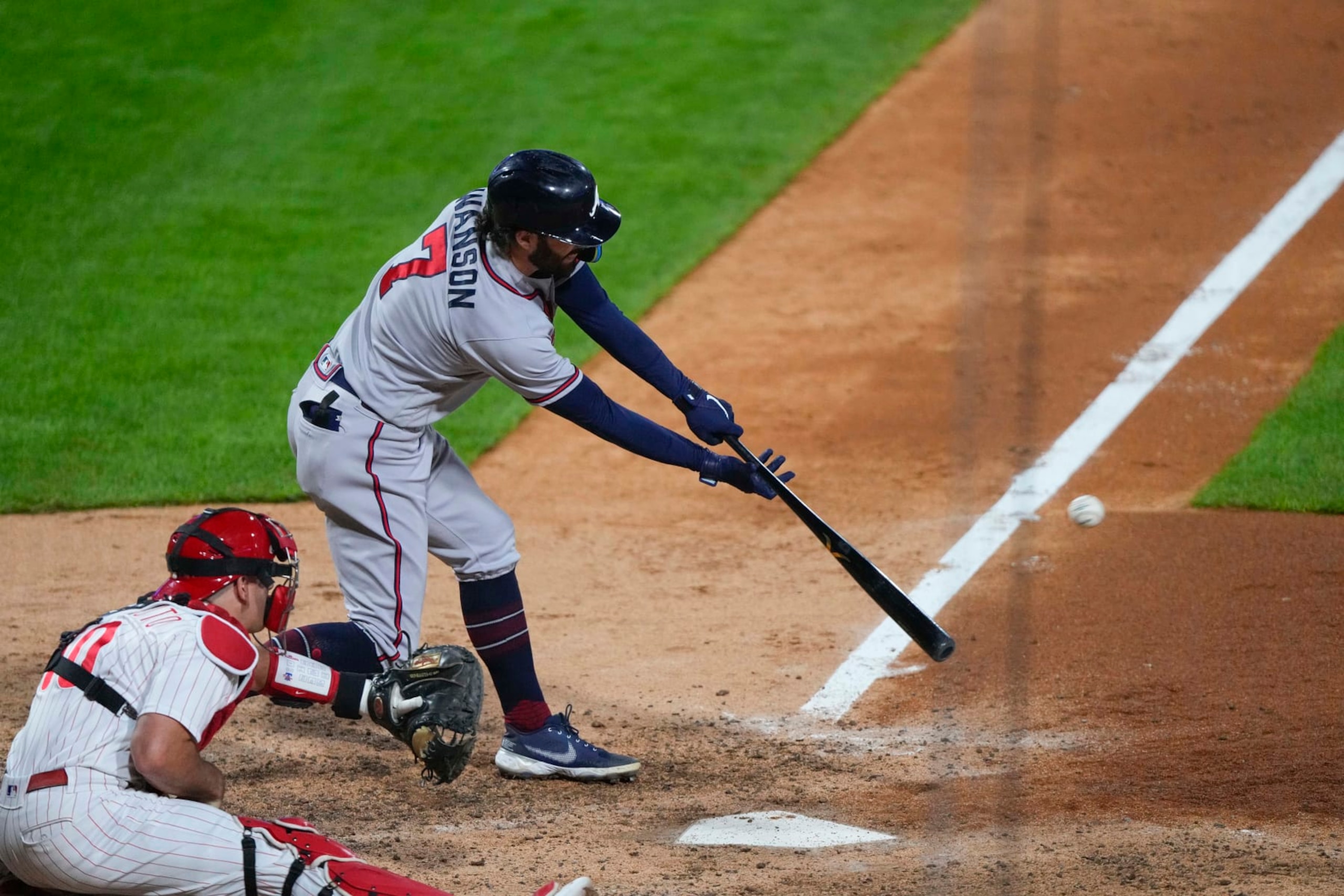 PHILADELPHIA, PA - OCTOBER 14:  Atlanta Braves Shortstop Dansby Swanson (7) hits a double during the sixth inning of Game 3 of the NLDS between the Atlanta Braves and the Philadelphia Phillies on October 14, 2022, at Citizens Bank Park in Philadelphia, PA. (Photo by Gregory Fisher/Icon Sportswire via Getty Images)
