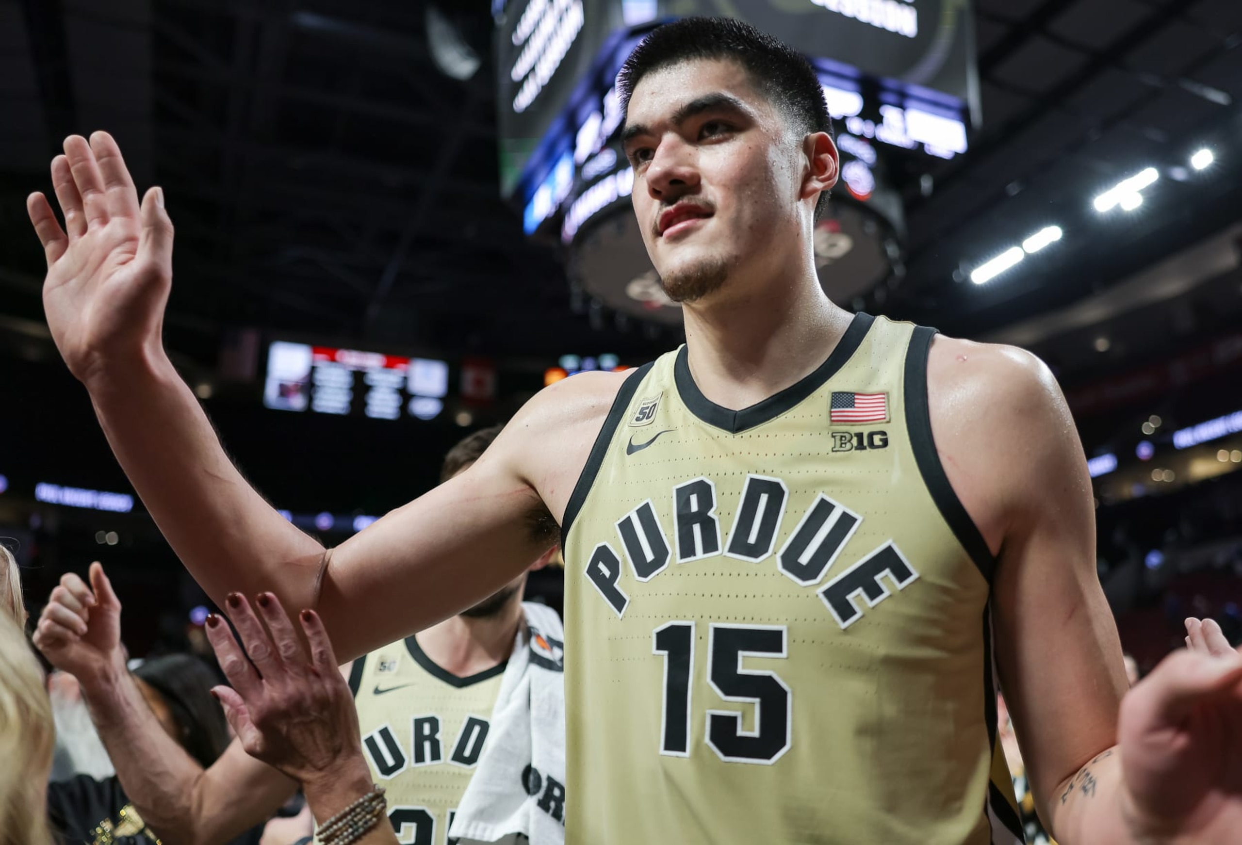 PORTLAND, OR - NOVEMBER 27: Zach Edey #15 of the Purdue Boilermakers celebrates with fans after the game against the Duke Blue Devils in the Phil Knight Legacy Tournament Men's Championship at Moda Center on November 27, 2022 in Portland, Oregon. (Photo by Michael Hickey/Getty Images)