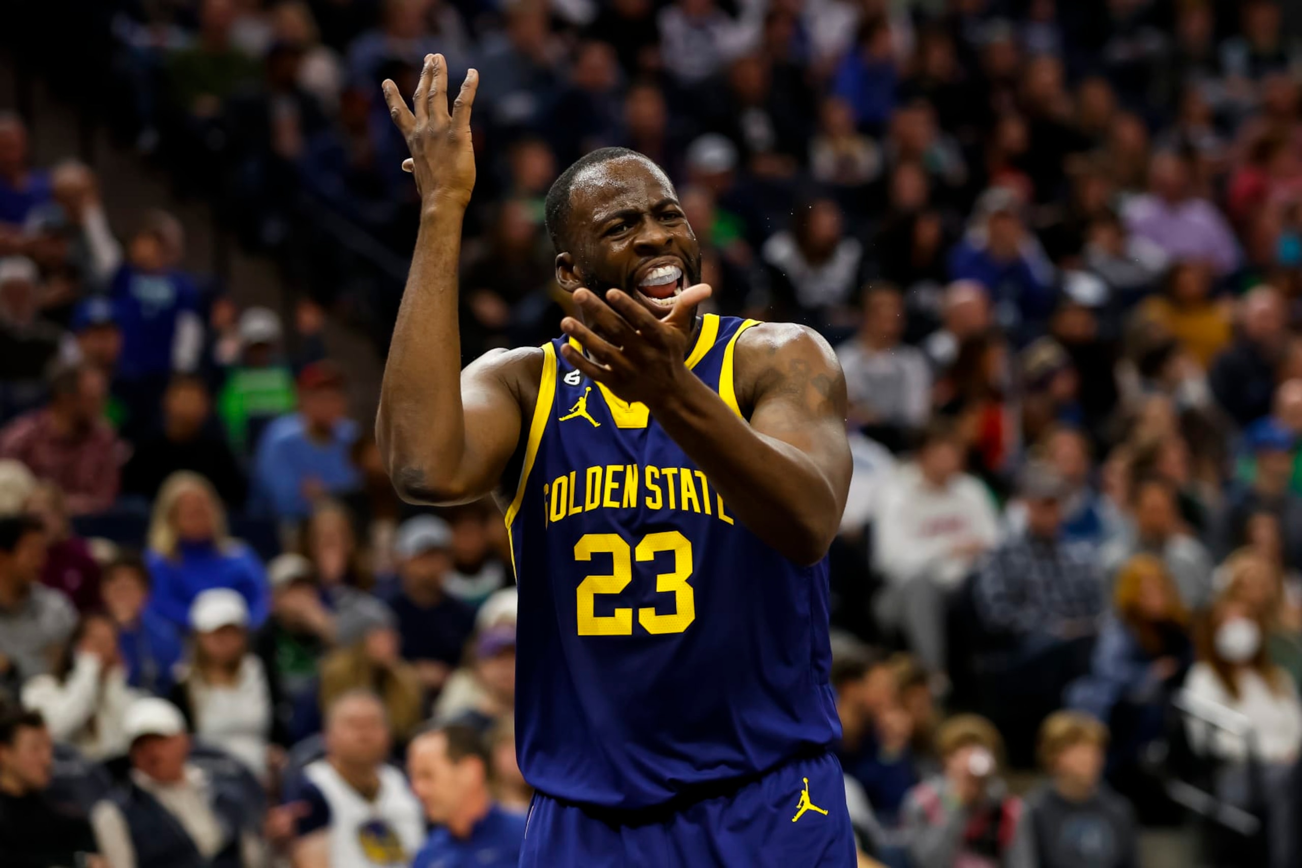 MINNEAPOLIS, MN - NOVEMBER 27: Draymond Green #23 of the Golden State Warriors reacts to a call on the floor in the fourth quarter against the Minnesota Timberwolves at Target Center on November 27, 2022 in Minneapolis, Minnesota. The Warriors defeated the Timberwolves 137-114. NOTE TO USER: User expressly acknowledges and agrees that, by downloading and or using this Photograph, user is consenting to the terms and conditions of the Getty Images License Agreement. (Photo by David Berding/Getty Images)