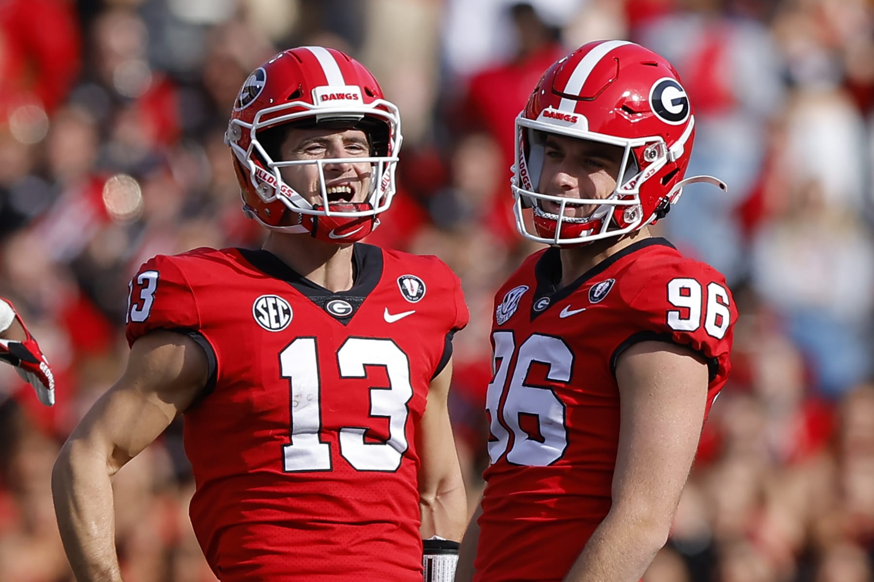 ATHENS, GA - NOVEMBER 26: Stetson Bennett #13 reacts with Jack Podlesny #96 of the Georgia Bulldogs in the second half against the Georgia Tech Yellow Jackets at Sanford Stadium on November 26, 2022 in Athens, Georgia. (Photo by Todd Kirkland/Getty Images)