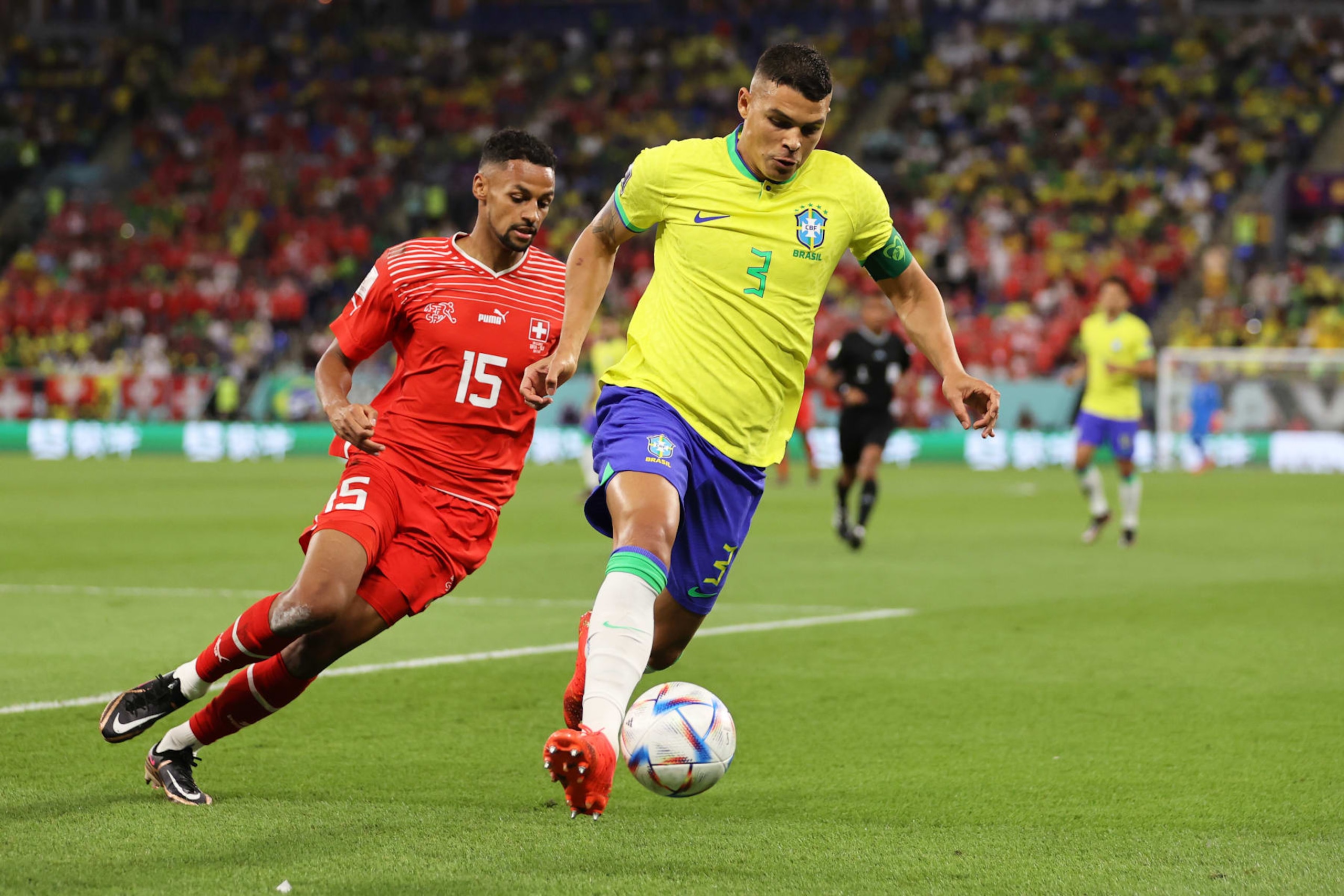 DOHA, QATAR - NOVEMBER 28: Thiago Silva of Brazil under pressure from Djibril Sow of Switzerland during the FIFA World Cup Qatar 2022 Group G match between Brazil and Switzerland at Stadium 974 on November 28, 2022 in Doha, Qatar. (Photo by Clive Brunskill/Getty Images)