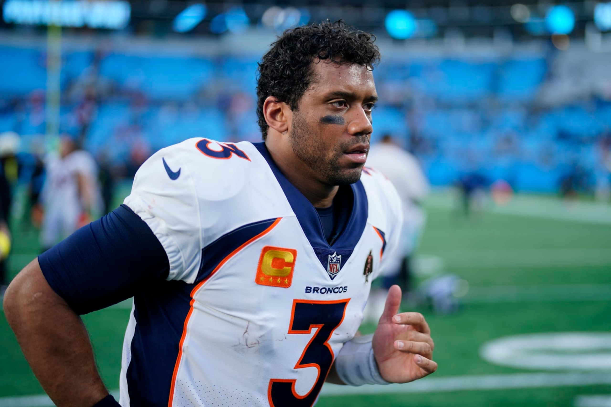 Denver Broncos quarterback Russell Wilson leaves the field after their loss during an NFL football game between the Carolina Panthers and the Denver Broncos on Sunday, Nov. 27, 2022, in Charlotte, N.C. (AP Photo/Jacob Kupferman) Denver Broncos quarterback Russell Wilson leaves the field after their loss during an NFL football game between the Carolina Panthers and the Denver Broncos on Sunday, Nov. 27, 2022, in Charlotte, N.C. (AP Photo/Jacob Kupferman)