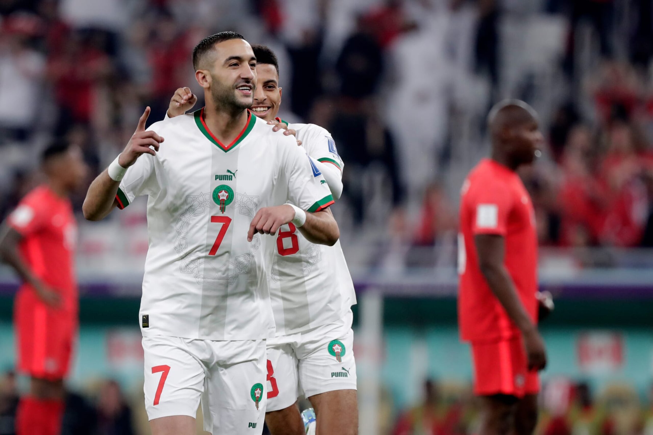 Hakim Ziyech (left) of Morocco celebrates with Azzedine Ounahi