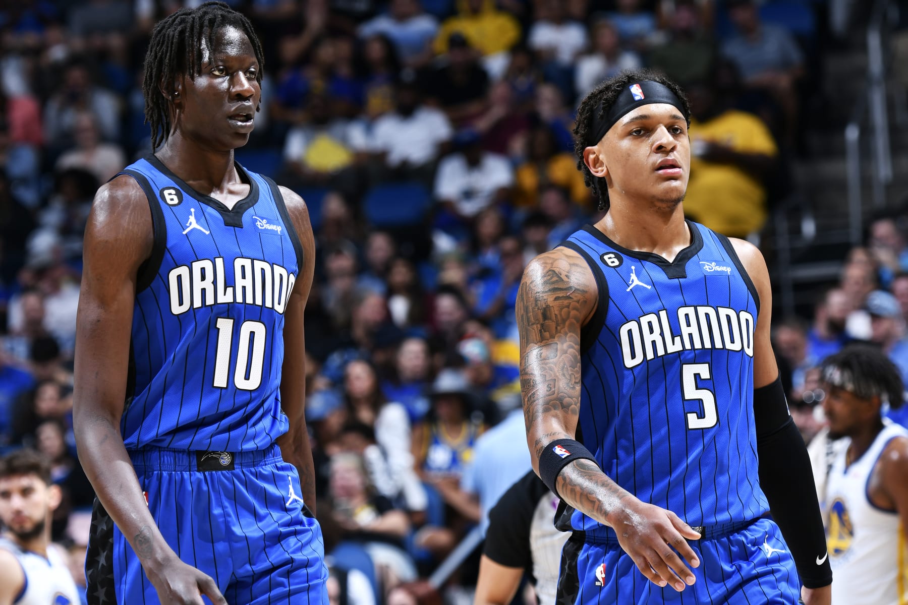 ORLANDO, FL - NOVEMBER 2: Bol Bol #10 of the Orlando Magic and Paolo Banchero #5 stand on the court during the game against the Golden State Warriors on November 2, 2022 at Amway Center in Orlando, Florida. NOTE TO USER: User expressly acknowledges and agrees that, by downloading and or using this photograph, User is consenting to the terms and conditions of the Getty Images License Agreement. Mandatory Copyright Notice: Copyright 2022 NBAE (Photo by Fernando Medina/NBAE via Getty Images)