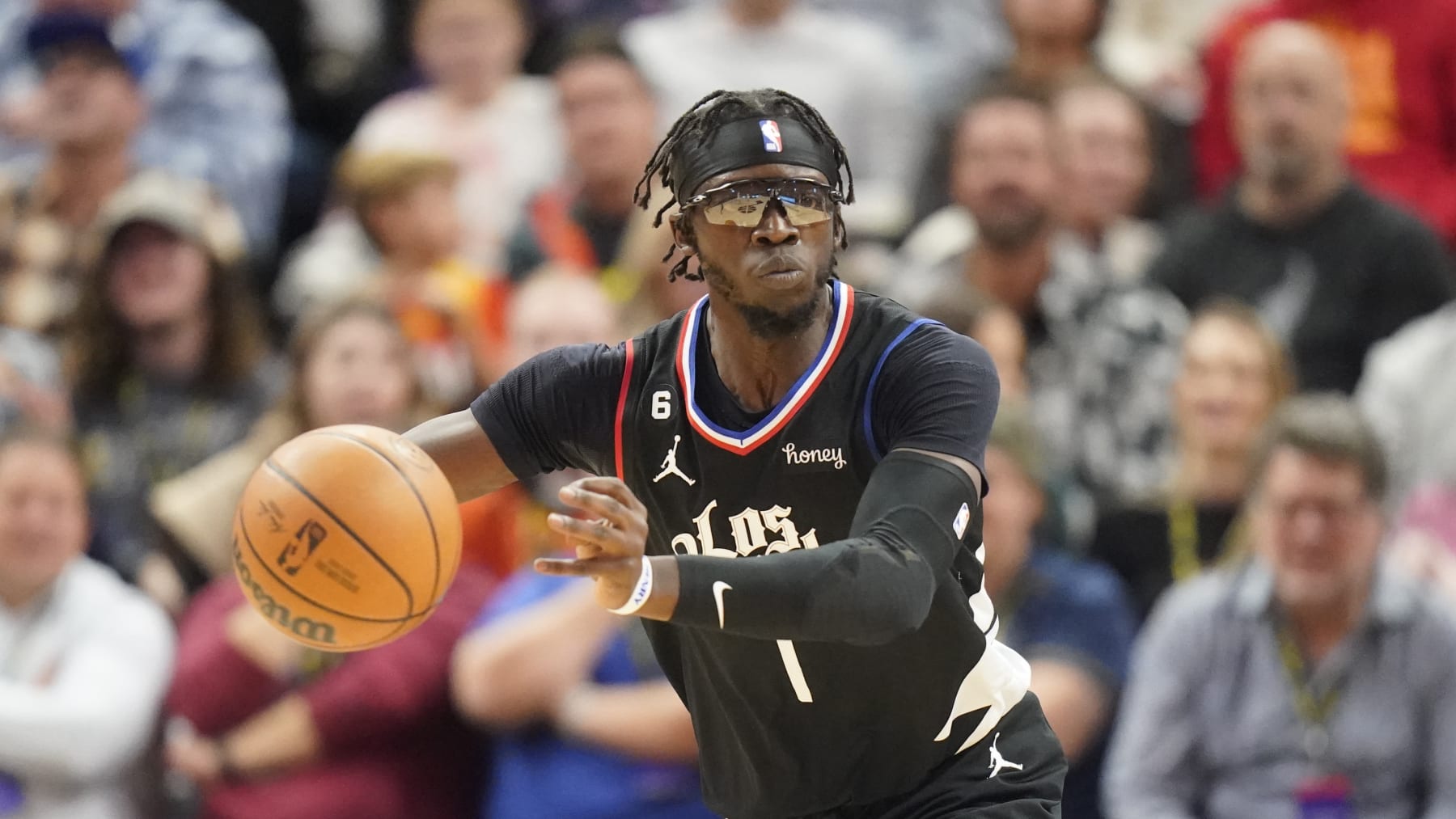 Los Angeles Clippers guard Reggie Jackson (1) brings the ball up court during the second half of an NBA basketball game against the Utah Jazz Wednesday, Nov. 30, 2022, in Salt Lake City. (AP Photo/Rick Bowmer)